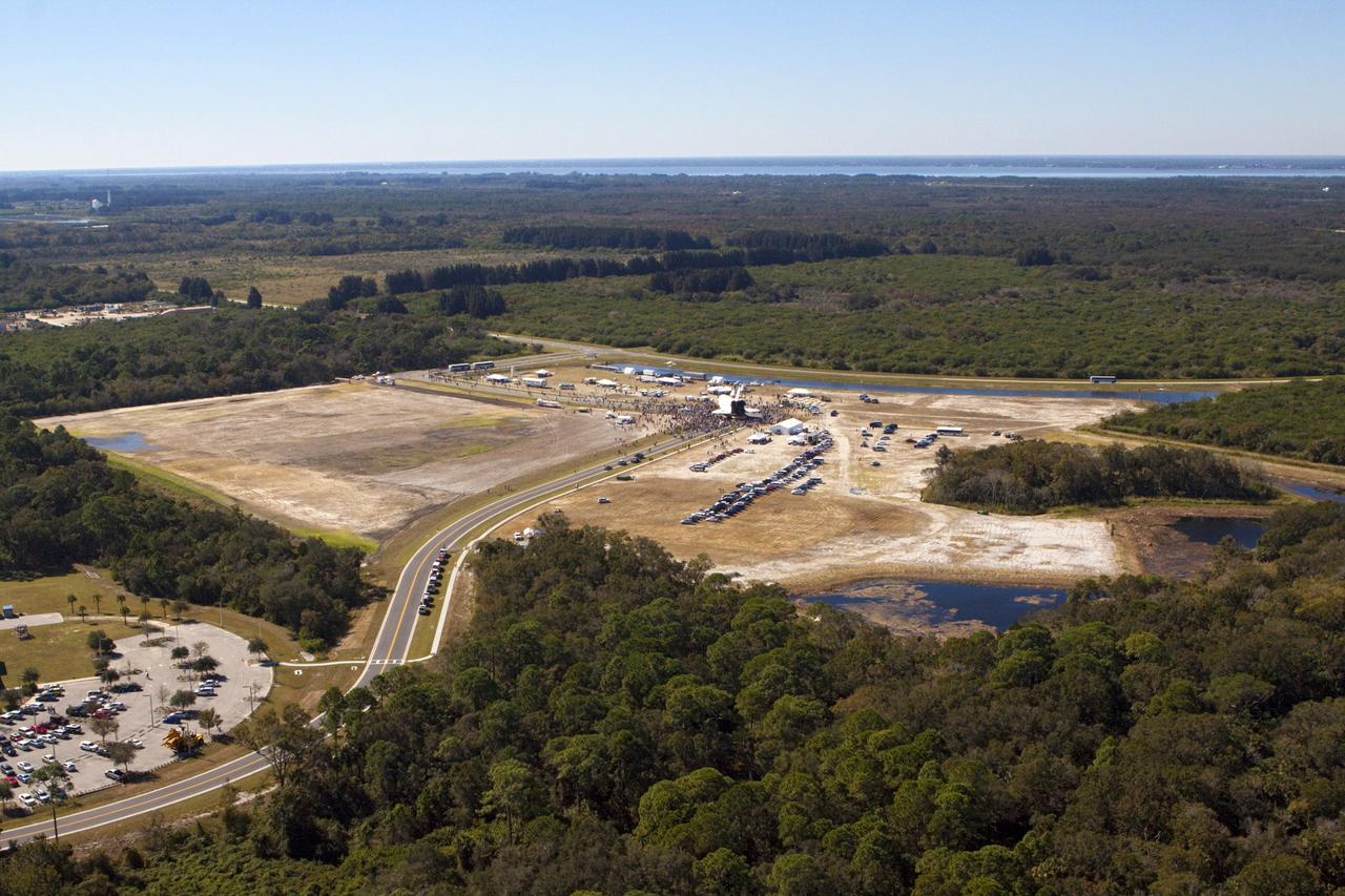 CAPE CANAVERAL, Fla. – At NASA's Kennedy Space Center in Florida, space shuttle Atlantis dwarfs the crowd gathered around it in Space Florida's Exploration Park during its 10-mile journey from the Vehicle Assembly Building to the Kennedy Space Center Visitor Complex. Atlantis stopped in the park for a viewing opportunity for visitor complex guests before completing the trip to its new home. As part of transition and retirement of the Space Shuttle Program, Atlantis will be displayed in a new exhibit hall at the visitor complex beginning in the summer of 2013. Over the course of its 26-year career, Atlantis traveled 125,935,769 miles, completing 33 missions during 307 days in space. For more information, visit http://www.nasa.gov/transition. Photo credit: NASA/Kim Shiflett