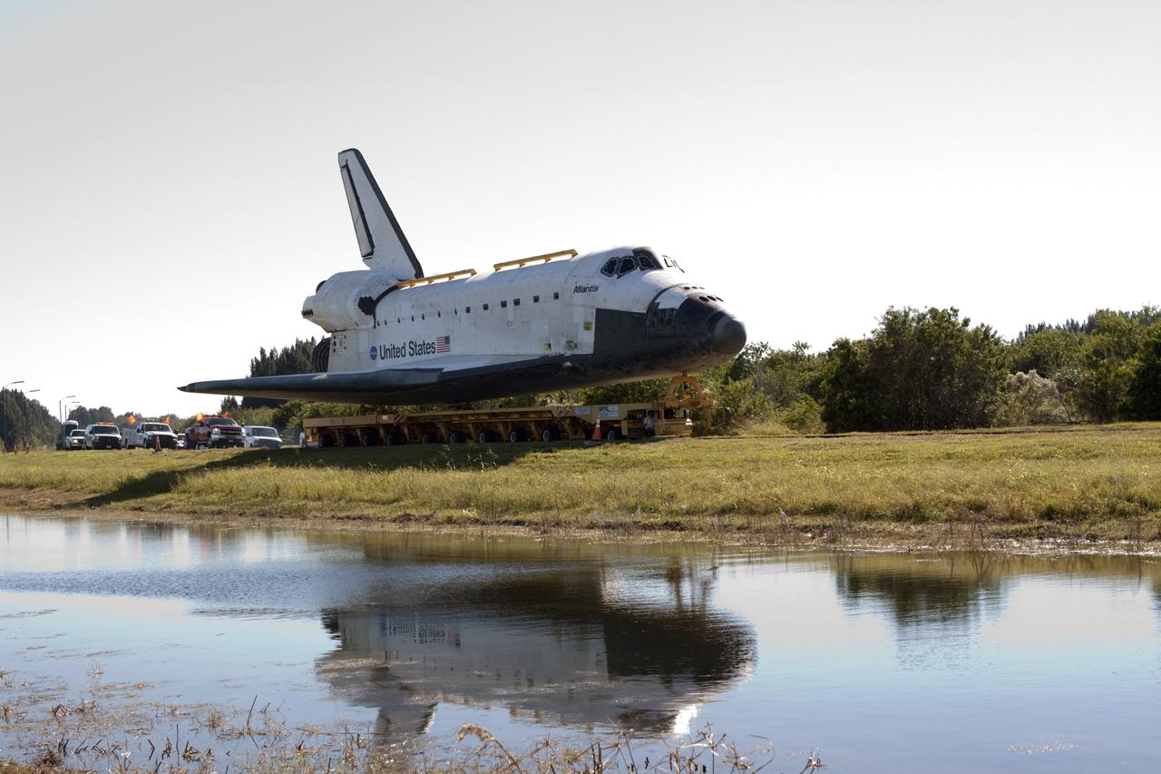 CAPE CANAVERAL, Fla. – After a stop at Space Florida's Exploration Park to provide a viewing opportunity for guests before completing the trip at its new home, the space shuttle Atlantis continues its 10-mile journey to the Kennedy Space Center Visitor Complex. As part of transition and retirement of the Space Shuttle Program, Atlantis is to be displayed at Kennedy's visitor complex beginning in the summer of 2013. Over the course of its 26-year career, Atlantis traveled 125,935,769 miles during 307 days in space over 33 missions. For more information, visit http://www.nasa.gov/transition. Photo credit: NASA/Jim Grossmann