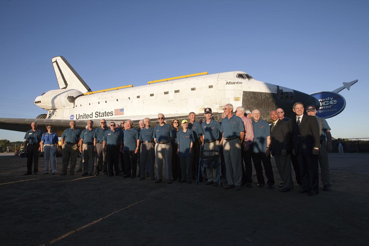 CAPE CANAVERAL, Fla. – The "wingwalkers" who accompanied space shuttle Atlantis on the final leg of its 10-hour journey from Kennedy Space Center's Vehicle Assembly Building to its new home, at Kennedy's visitor complex in Florida, pose for a group portrait. The group includes numerous current and former astronauts, including NASA Administrator Charlie Bolden and Kennedy Director Bob Cabana, at front right.    As part of transition and retirement of the Space Shuttle Program, Atlantis will be displayed in a new exhibit hall at Kennedy's visitor complex beginning in the summer of 2013. Over the course of its 26-year career, Atlantis traveled 125,935,769 miles, completing 33 missions during 307 days in space. For more information, visit http://www.nasa.gov/transition.  Photo credit: NASA/Kim Shiflett