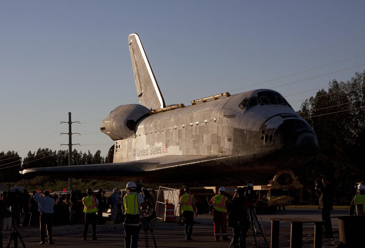 CAPE CANAVERAL, Fla. – Kennedy Space Center workers and members of the media watch as space shuttle Atlantis is transported along the NASA Causeway on its 10-mile journey from NASA Kennedy Space Center’s Vehicle Assembly Building in Florida to the Kennedy Visitor Complex where it will be put on public display. As part of transition and retirement of the Space Shuttle Program, Atlantis will be displayed at Kennedy’s Visitor Complex beginning in the summer of 2013. Over the course of its 26-year career, Atlantis traveled 125,935,769 miles during 307 days in space over 33 missions. For more information, visit http://www.nasa.gov/transition. Photo credit: NASA/Jim Grossmann