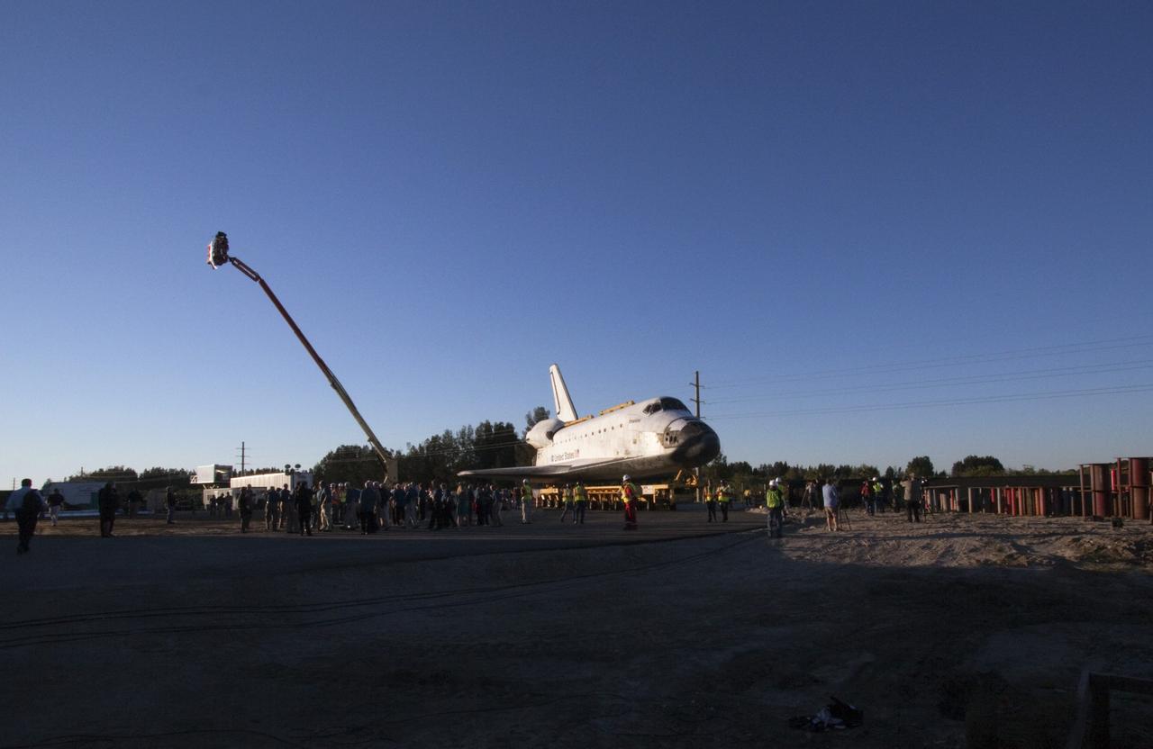 CAPE CANAVERAL, Fla. – Kennedy Space Center workers and members of the media watch as space shuttle Atlantis arrives at the Kennedy Space Center Visitor Complex in Florida where it will be put on public display. Atlantis completed its 10-mile journey from Kennedy’s Vehicle Assembly Building. As part of transition and retirement of the Space Shuttle Program, Atlantis will be displayed at Kennedy’s Visitor Complex beginning in the summer of 2013. Over the course of its 26-year career, Atlantis traveled 125,935,769 miles during 307 days in space over 33 missions. For more information, visit http://www.nasa.gov/transition. Photo credit: NASA/Jim Grossmann