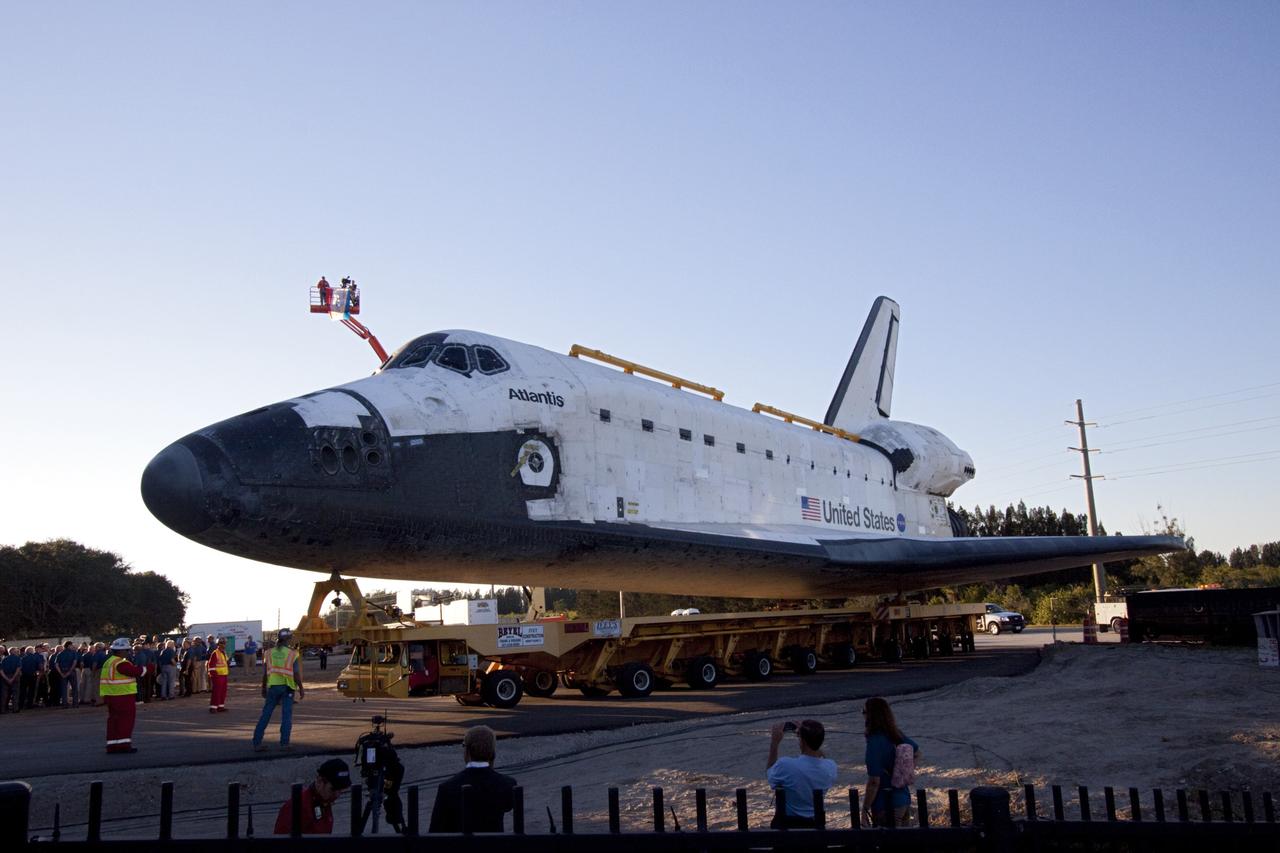 CAPE CANAVERAL, Fla. – Kennedy Space Center workers, guests and members of the media watch as space shuttle Atlantis arrives at the Kennedy Space Center Visitor Complex in Florida where it will be put on public display. Atlantis completed its 10-mile journey from Kennedy’s Vehicle Assembly Building. As part of transition and retirement of the Space Shuttle Program, Atlantis will be displayed at Kennedy’s Visitor Complex beginning in the summer of 2013. Over the course of its 26-year career, Atlantis traveled 125,935,769 miles during 307 days in space over 33 missions. For more information, visit http://www.nasa.gov/transition. Photo credit: NASA/Jim Grossmann