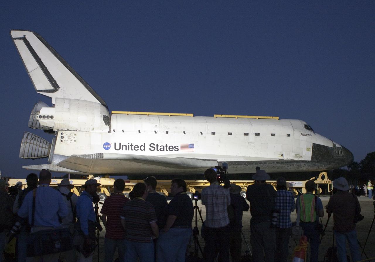 CAPE CANAVERAL, Fla. – Photographers take pictures of space shuttle Atlantis as it completes the 10-mile trip from the Vehicle Assembly Building at NASA’s Kennedy Space Center in Florida to the Kennedy Visitor Complex. As part of transition and retirement of the Space Shuttle Program, Atlantis will be displayed at Kennedy’s Visitor Complex beginning in the summer of 2013. Over the course of its 26-year career, Atlantis traveled 125,935,769 miles during 307 days in space over 33 missions. For more information, visit http://www.nasa.gov/transition. Photo credit: NASA/Jim Grossmann