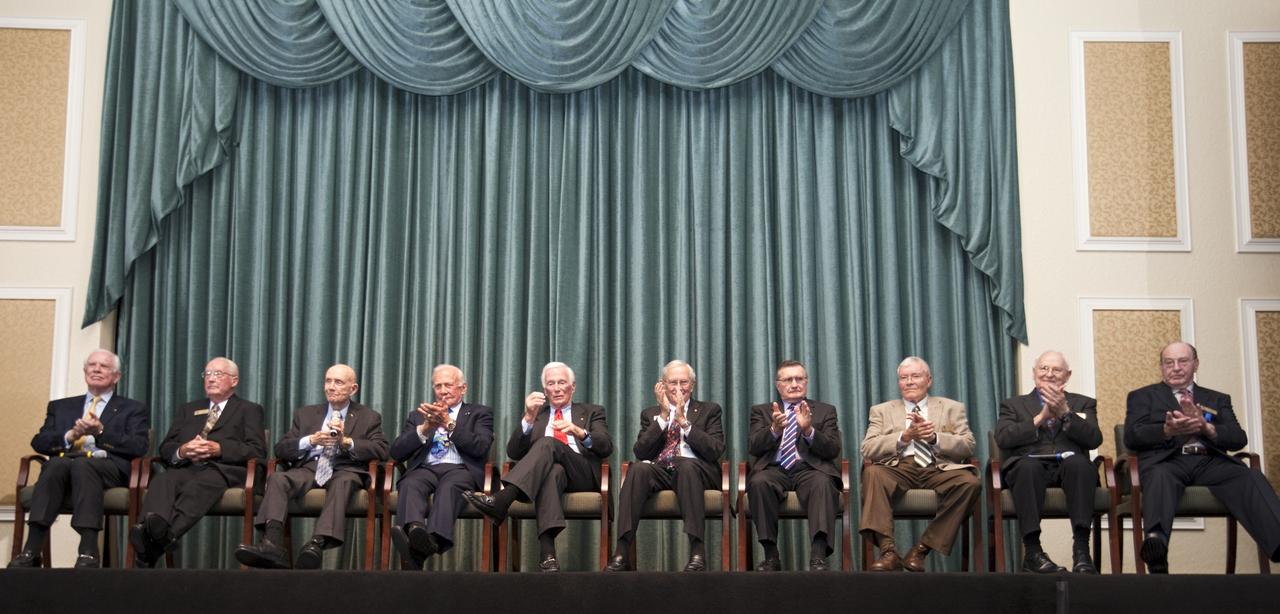 CAPE CANAVERAL, Fla. – Apollo astronauts, from the left, David Scott, James McDivitt, Thomas Stafford, Buzz Aldrin, Eugene Cernan, Charles Duke, Richard Gordon, Fred Haise, Alan Bean and Edgar Mitchell speak to guests gathered for the Astronaut Scholarship Foundation's dinner at the Radisson Resort at the Port in Cape Canaveral celebrating the 40th anniversary of Apollo 17.  The gala commemorating the anniversary of Apollo 17 included mission commander Eugene Cernan and other astronauts who flew Apollo missions. Launched Dec. 7, 1972, Cernan and lunar module pilot Harrison Schmitt landed in the moon's Taurus-Littrow highlands while command module pilot Ronald Evans remained in lunar orbit operating a scientific instrument module. For more information, visit http://www-pao.ksc.nasa.gov/history/apollo/apollo-17/apollo-17.htm Photo credit: NASA/Kim Shiflett