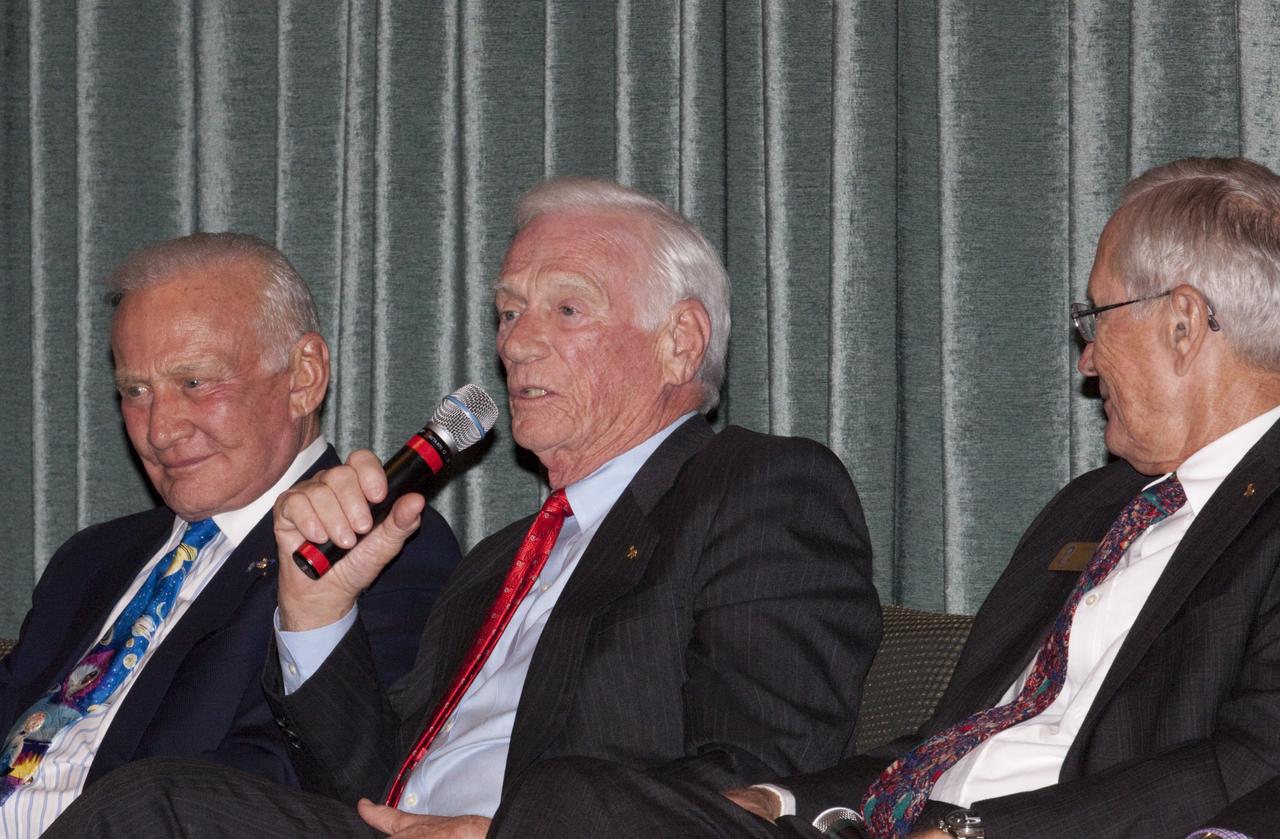 CAPE CANAVERAL, Fla. – Gemini 9, Apollo 10 and 17 astronaut Eugene Cernan speaks to guests gathered for the Astronaut Scholarship Foundation's dinner at the Radisson Resort at the Port in Cape Canaveral celebrating the 40th anniversary of Apollo 17. Listening on the left is Gemini 12 and Apollo 11 astronaut Buzz Aldrin, along with Apollo 16 astronaut Charles Duke.  The gala commemorating the anniversary of Apollo 17 included mission commander Eugene Cernan and other astronauts who flew Apollo missions. Launched Dec. 7, 1972, Cernan and lunar module pilot Harrison Schmitt landed in the moon's Taurus-Littrow highlands while command module pilot Ronald Evans remained in lunar orbit operating a scientific instrument module. For more information, visit http://www-pao.ksc.nasa.gov/history/apollo/apollo-17/apollo-17.htm Photo credit: NASA/Kim Shiflett