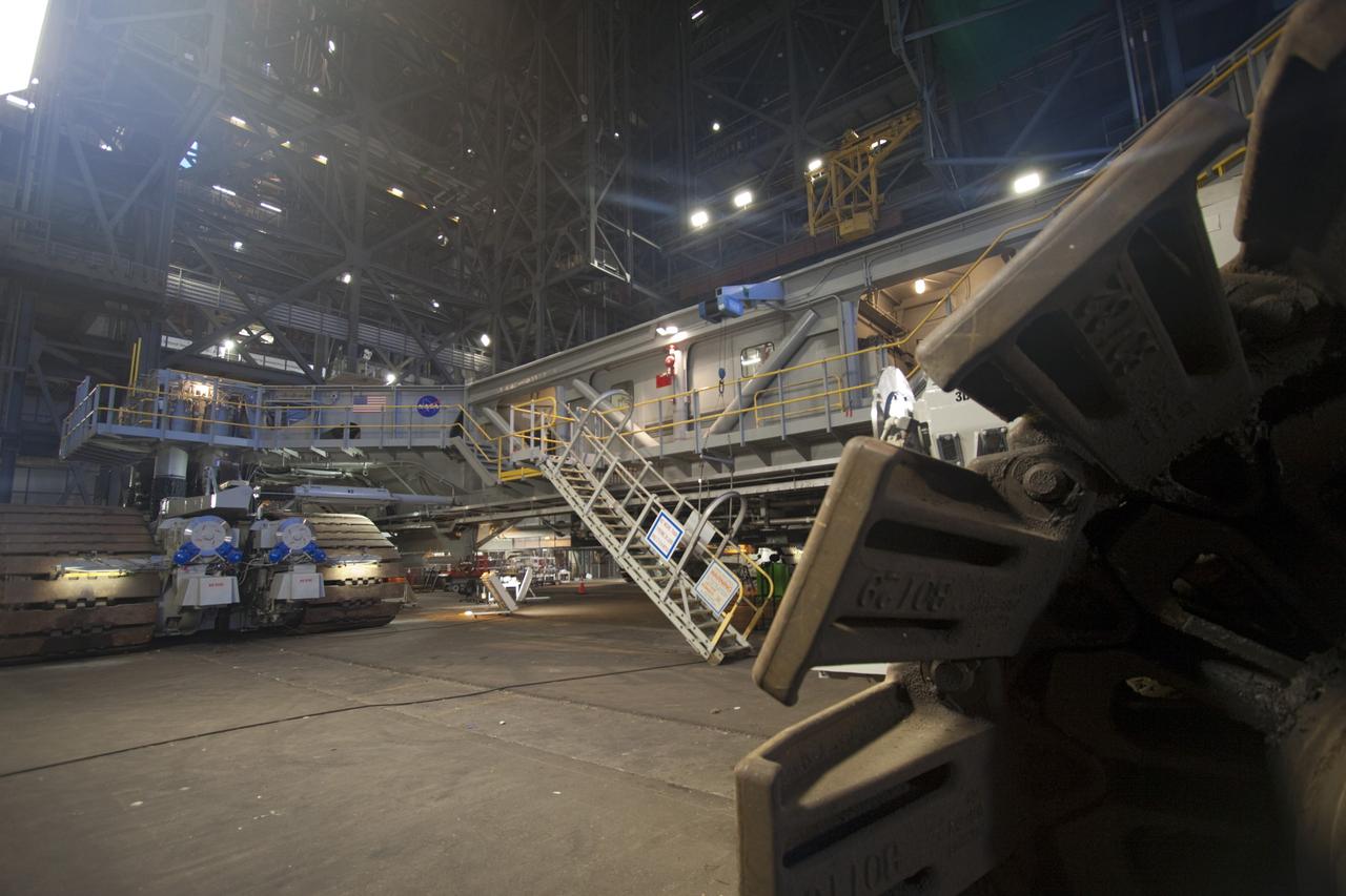CAPE CANAVERAL, Fla. -- At NASA's Kennedy Space Center in Florida, crawler-transporter No. 2 has been undergoing modifications inside high bay 2 of the Vehicle Assembly Building in preparation to carry the space agency's Space Launch System heavy-lift rocket to the launch pad. NASA's Ground Systems Development and Operations Program is leading the 20-year life-extension project for the crawler. A pair of behemoth machines called crawler-transporters has carried the load of taking rockets and spacecraft to the launch pad for more than 40 years at NASA’s Kennedy Space Center in Florida. Each the size of a baseball infield and powered by locomotive and large electrical power generator engines, the crawler-transporters will stand ready to keep up the work for the next generation of launch vehicles projects to lift astronauts into space. For more information, visit http://www.nasa.gov/exploration/systems/ground/index.html Photo credit: NASA/Jim Grossmann