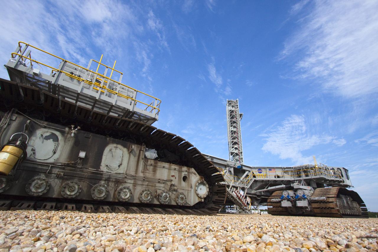 CAPE CANAVERAL, Fla. -- At NASA's Kennedy Space Center in Florida, crawler-transporter No. 2 has been undergoing modifications in high bay 2 of the Vehicle Assembly Building. It has been undergoing a test drive checking out modifications to ensure its ability to carry launch vehicles to the launch pad. In the background is the mobile launcher being prepared to support the space agency's Space Launch System heavy-lift rocket and Orion spacecraft. NASA's Ground Systems Development and Operations Program is leading the 20-year life-extension project for the crawler. A pair of behemoth machines called crawler-transporters has carried the load of taking rockets and spacecraft to the launch pad for more than 40 years at NASA’s Kennedy Space Center in Florida. Each the size of a baseball infield and powered by locomotive and large electrical power generator engines, the crawler-transporters will stand ready to keep up the work for the next generation of launch vehicles projects to lift astronauts into space. For more information, visit http://www.nasa.gov/exploration/systems/ground/index.html Photo credit: NASA/Jim Grossmann