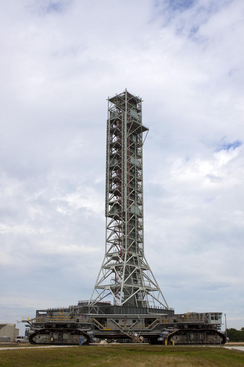 CAPE CANAVERAL, Fla. -- At NASA's Kennedy Space Center in Florida, crawler-transporter No. 2 has been undergoing modifications in high bay 2 of the Vehicle Assembly Building. It has been undergoing a test drive checking out modifications to ensure its ability to carry the space agency's Space Launch System heavy-lift rocket to the launch pad. In the background is the mobile launcher being prepared to support launch vehicles such as space agency's the Space Launch System heavy-lift rocket and Orion spacecraft. NASA's Ground Systems Development and Operations Program is leading the 20-year life-extension project for the crawler. A pair of behemoth machines called crawler-transporters has carried the load of taking rockets and spacecraft to the launch pad for more than 40 years at NASA’s Kennedy Space Center in Florida. Each the size of a baseball infield and powered by locomotive and large electrical power generator engines, the crawler-transporters will stand ready to keep up the work for the next generation of launch vehicles projects to lift astronauts into space. For more information, visit http://www.nasa.gov/exploration/systems/ground/index.html Photo credit: NASA/Jim Grossmann