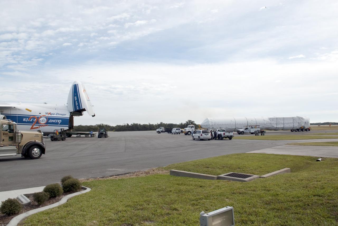 CAPE CANAVERAL, Fla. -- The first stage of the Atlas V rocket that will carry the Tracking and Data Relay Satellite, TDRS-K, into orbit has been off loaded from a Ukrainian Antonov-124 transport aircraft after its arrival at Cape Canaveral Air Force Station in Florida. The booster stage was delivered from the United Launch Alliance manufacturing plant in Decatur, Ala., and will be taken to the hangar at the Atlas Spaceflight Operations Center at Cape Canaveral to begin processing. Launch of the TDRS-K on the Atlas V rocket is planned for January 2013 from Space Launch Complex 41. The TDRS-K spacecraft is part of the next-generation series in the Tracking and Data Relay Satellite System, a constellation of space-based communication satellites providing tracking, telemetry, command and high-bandwidth data return services. For more information, visit http://tdrs.gsfc.nasa.gov/ Photo credit: NASA/Charisse Nahser