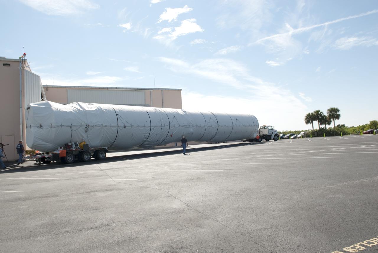 CAPE CANAVERAL, Fla. -- The first stage of the Atlas V rocket that will carry the Tracking and Data Relay Satellite, TDRS-K, into orbit arrives at the hangar at the Atlas Spaceflight Operations Center at Cape Canaveral Air Force Station in Florida to begin processing. Launch of the TDRS-K on the Atlas V rocket is planned for January 2013 from Space Launch Complex 41. The TDRS-K spacecraft is part of the next-generation series in the Tracking and Data Relay Satellite System, a constellation of space-based communication satellites providing tracking, telemetry, command and high-bandwidth data return services. For more information, visit http://tdrs.gsfc.nasa.gov/ Photo credit: NASA/Charisse Nahser