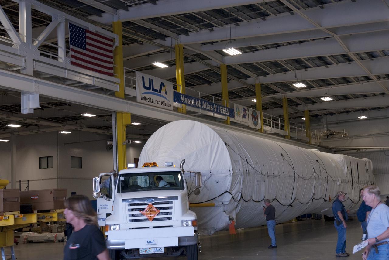 CAPE CANAVERAL, Fla. -- The first stage of the Atlas V rocket that will carry the Tracking and Data Relay Satellite, TDRS-K, into orbit arrives at the hangar at the Atlas Spaceflight Operations Center at Cape Canaveral Air Force Station in Florida to begin processing. Launch of the TDRS-K on the Atlas V rocket is planned for January 2013 from Space Launch Complex 41. The TDRS-K spacecraft is part of the next-generation series in the Tracking and Data Relay Satellite System, a constellation of space-based communication satellites providing tracking, telemetry, command and high-bandwidth data return services. For more information, visit http://tdrs.gsfc.nasa.gov/ Photo credit: NASA/Charisse Nahser