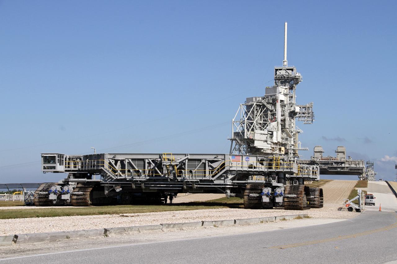 CAPE CANAVERAL, Fla. -- At NASA's Kennedy Space Center in Florida, crawler-transporter No. 2 arrives at Launch Pad 39A to check out recently completed modifications to ensure its ability to carry launch vehicles such as the space agency's Space Launch System heavy-lift rocket to the pad. NASA's Ground Systems Development and Operations Program is leading the 20-year life-extension project for the crawler. A pair of behemoth machines called crawler-transporters has carried the load of taking rockets and spacecraft to the launch pad for more than 40 years at NASA’s Kennedy Space Center in Florida. Each the size of a baseball infield and powered by locomotive and large electrical power generator engines, the crawler-transporters will stand ready to keep up the work for the next generation of launch vehicles projects to lift astronauts into space. For more information, visit http://www.nasa.gov/exploration/systems/ground/index.html Photo credit: NASA/Ben Smegelsky