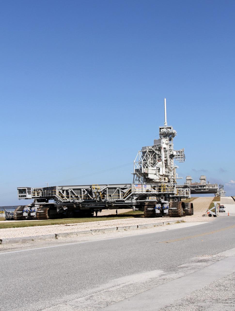 CAPE CANAVERAL, Fla. -- At NASA's Kennedy Space Center in Florida, crawler-transporter No. 2 arrives at Launch Pad 39A to check out recently completed modifications to ensure its ability to carry launch vehicles such as the space agency's Space Launch System heavy-lift rocket to the pad. NASA's Ground Systems Development and Operations Program is leading the 20-year life-extension project for the crawler. A pair of behemoth machines called crawler-transporters has carried the load of taking rockets and spacecraft to the launch pad for more than 40 years at NASA’s Kennedy Space Center in Florida. Each the size of a baseball infield and powered by locomotive and large electrical power generator engines, the crawler-transporters will stand ready to keep up the work for the next generation of launch vehicles projects to lift astronauts into space. For more information, visit http://www.nasa.gov/exploration/systems/ground/index.html Photo credit: NASA/Ben Smegelsky