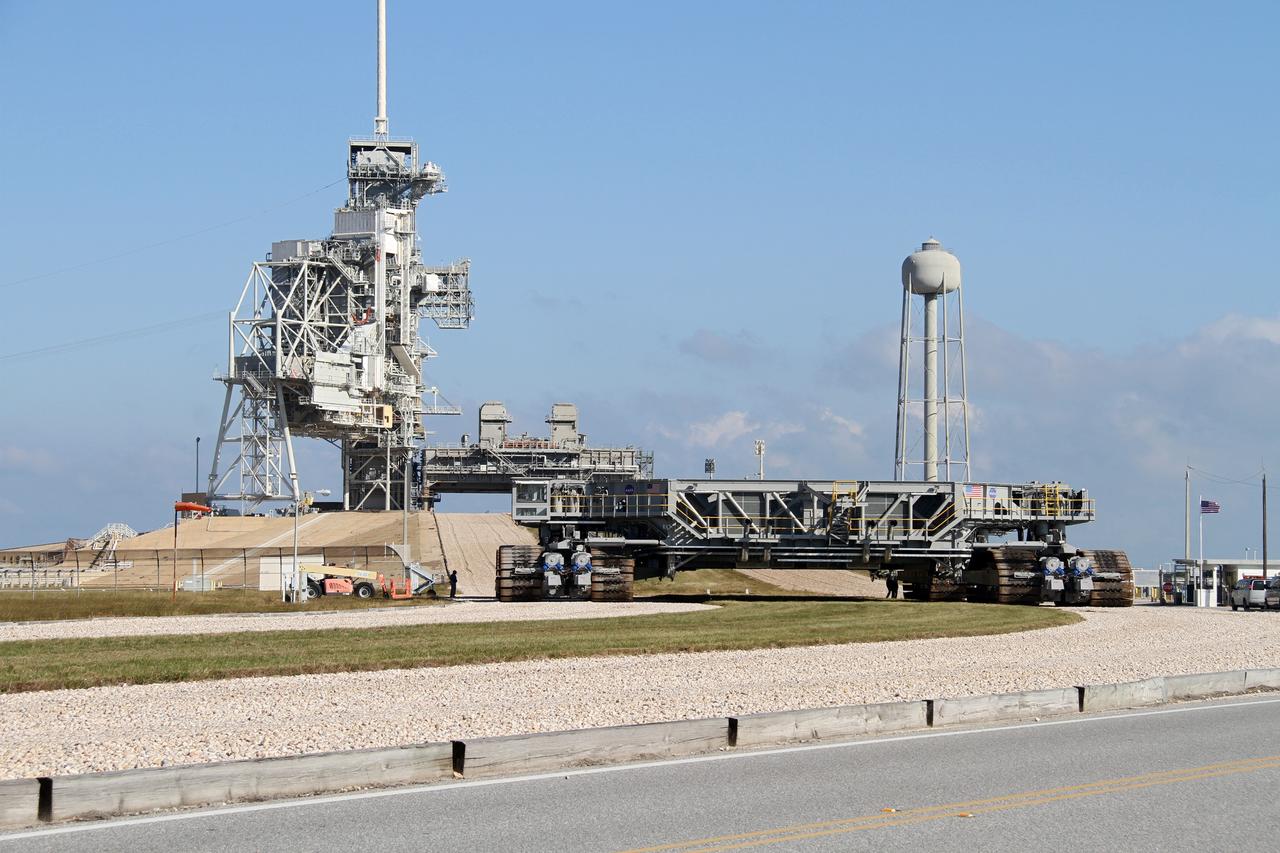 CAPE CANAVERAL, Fla. -- At NASA's Kennedy Space Center in Florida, crawler-transporter No. 2 arrives at Launch Pad 39A to check out recently completed modifications to ensure its ability to carry launch vehicles such as the space agency's Space Launch System heavy-lift rocket to the pad. NASA's Ground Systems Development and Operations Program is leading the 20-year life-extension project for the crawler. A pair of behemoth machines called crawler-transporters has carried the load of taking rockets and spacecraft to the launch pad for more than 40 years at NASA’s Kennedy Space Center in Florida. Each the size of a baseball infield and powered by locomotive and large electrical power generator engines, the crawler-transporters will stand ready to keep up the work for the next generation of launch vehicles projects to lift astronauts into space. For more information, visit http://www.nasa.gov/exploration/systems/ground/index.html Photo credit: NASA/Ben Smegelsky