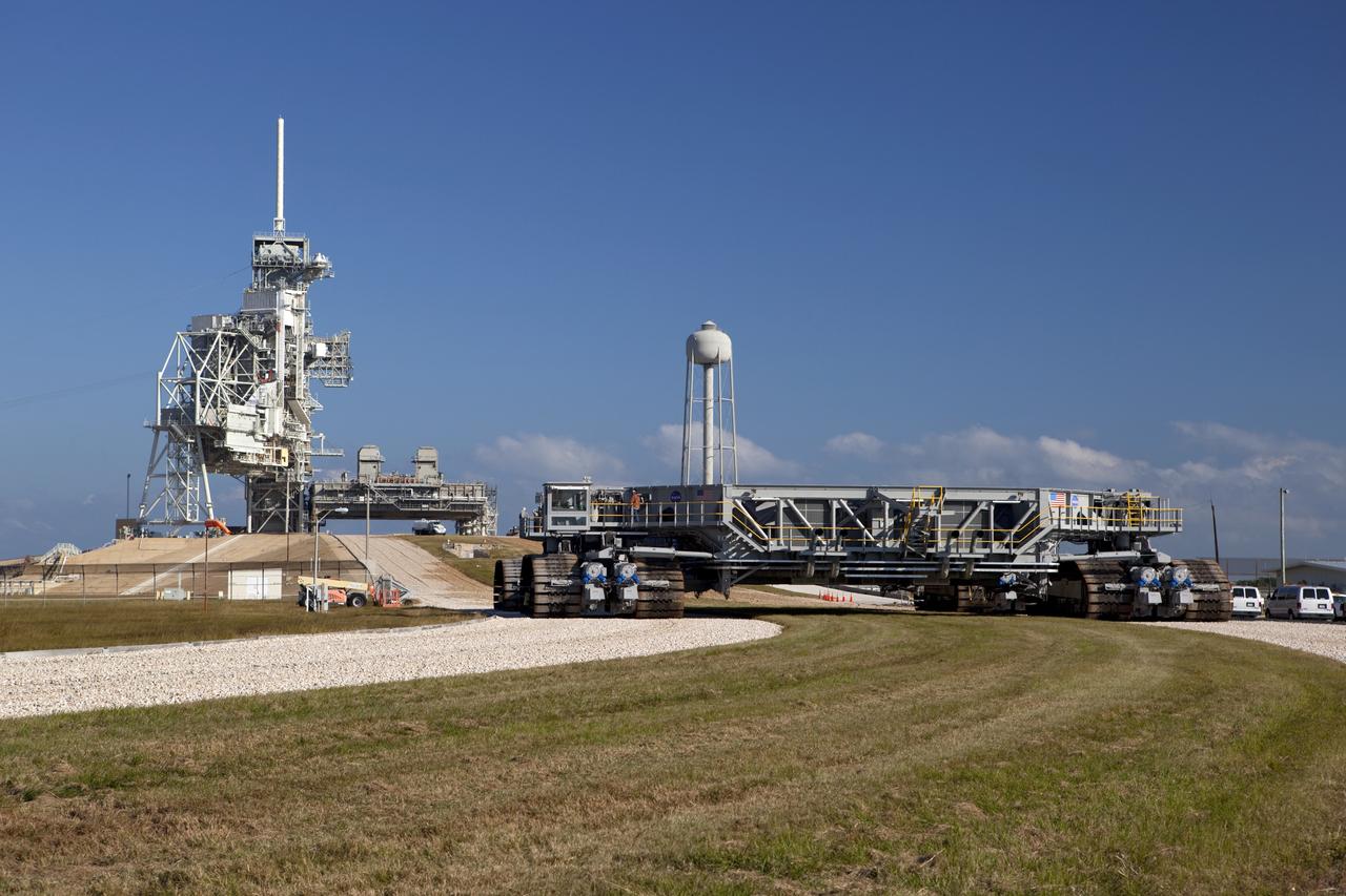 CAPE CANAVERAL, Fla. -- At NASA's Kennedy Space Center in Florida, crawler-transporter No. 2 arrives at Launch Pad 39A to check out recently completed modifications to ensure its ability to carry launch vehicles such as the space agency's Space Launch System heavy-lift rocket to the pad. NASA's Ground Systems Development and Operations Program is leading the 20-year life-extension project for the crawler. A pair of behemoth machines called crawler-transporters has carried the load of taking rockets and spacecraft to the launch pad for more than 40 years at NASA’s Kennedy Space Center in Florida. Each the size of a baseball infield and powered by locomotive and large electrical power generator engines, the crawler-transporters will stand ready to keep up the work for the next generation of launch vehicles to lift astronauts into space. For more information, visit http://www.nasa.gov/exploration/systems/ground/index.html Photo credit: NASA/ Dimitri Gerondidakis