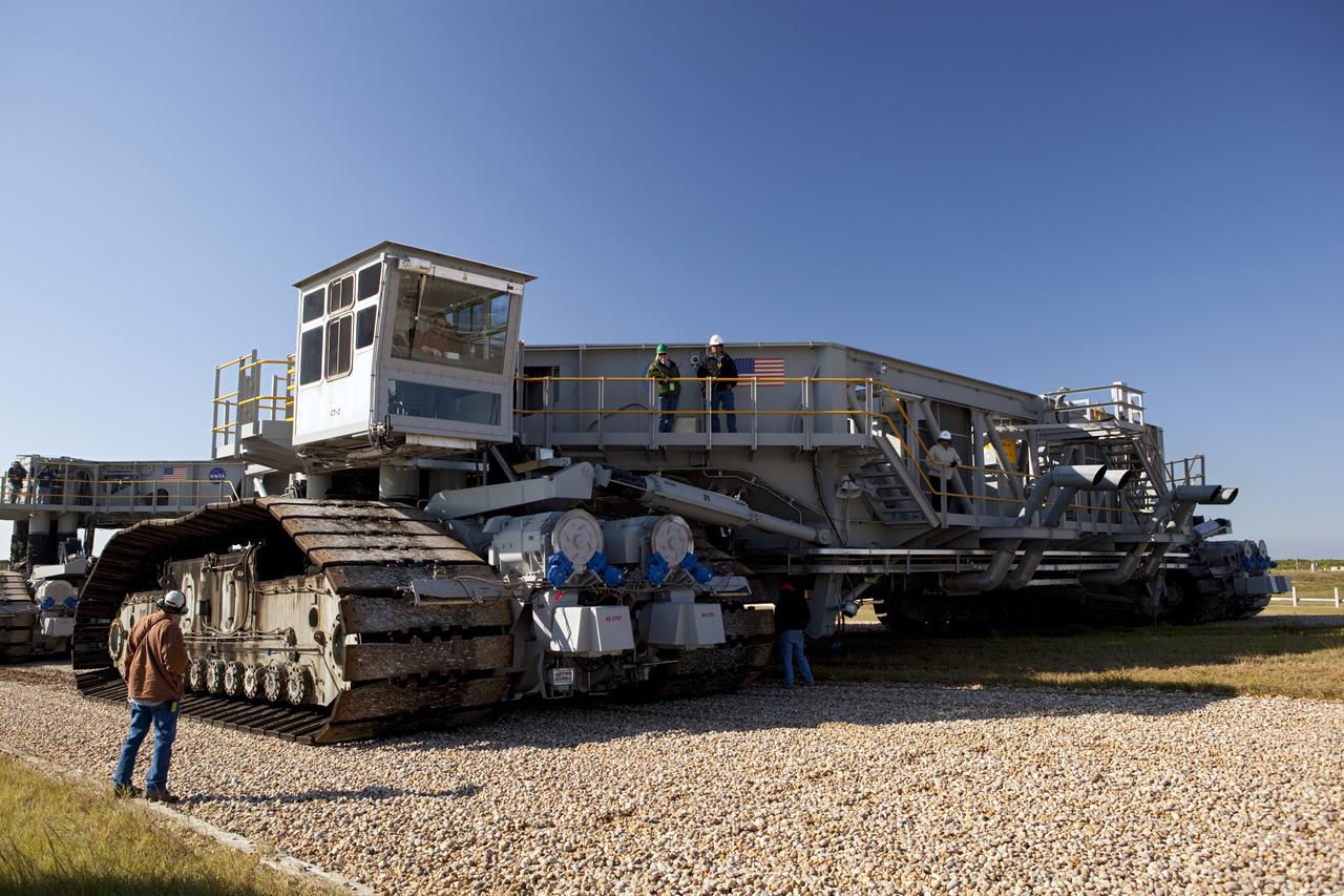 CAPE CANAVERAL, Fla. -- At NASA's Kennedy Space Center in Florida, crawler-transporter No. 2 arrives at Launch Pad 39A to check out recently completed modifications to ensure its ability to carry launch vehicles such as the space agency's Space Launch System heavy-lift rocket to the pad. NASA's Ground Systems Development and Operations Program is leading the 20-year life-extension project for the crawler. A pair of behemoth machines called crawler-transporters has carried the load of taking rockets and spacecraft to the launch pad for more than 40 years at NASA’s Kennedy Space Center in Florida. Each the size of a baseball infield and powered by locomotive and large electrical power generator engines, the crawler-transporters will stand ready to keep up the work for the next generation of launch vehicles to lift astronauts into space. For more information, visit http://www.nasa.gov/exploration/systems/ground/index.html Photo credit: NASA/ Dimitri Gerondidakis
