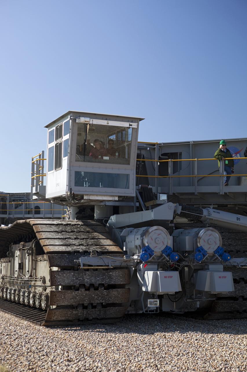 CAPE CANAVERAL, Fla. -- At NASA's Kennedy Space Center in Florida, crawler-transporter No. 2 arrives at Launch Pad 39A to check out recently completed modifications to ensure its ability to carry launch vehicles such as the space agency's Space Launch System heavy-lift rocket to the pad. NASA's Ground Systems Development and Operations Program is leading the 20-year life-extension project for the crawler. A pair of behemoth machines called crawler-transporters has carried the load of taking rockets and spacecraft to the launch pad for more than 40 years at NASA’s Kennedy Space Center in Florida. Each the size of a baseball infield and powered by locomotive and large electrical power generator engines, the crawler-transporters will stand ready to keep up the work for the next generation of launch vehicles to lift astronauts into space. For more information, visit http://www.nasa.gov/exploration/systems/ground/index.html Photo credit: NASA/ Dimitri Gerondidakis