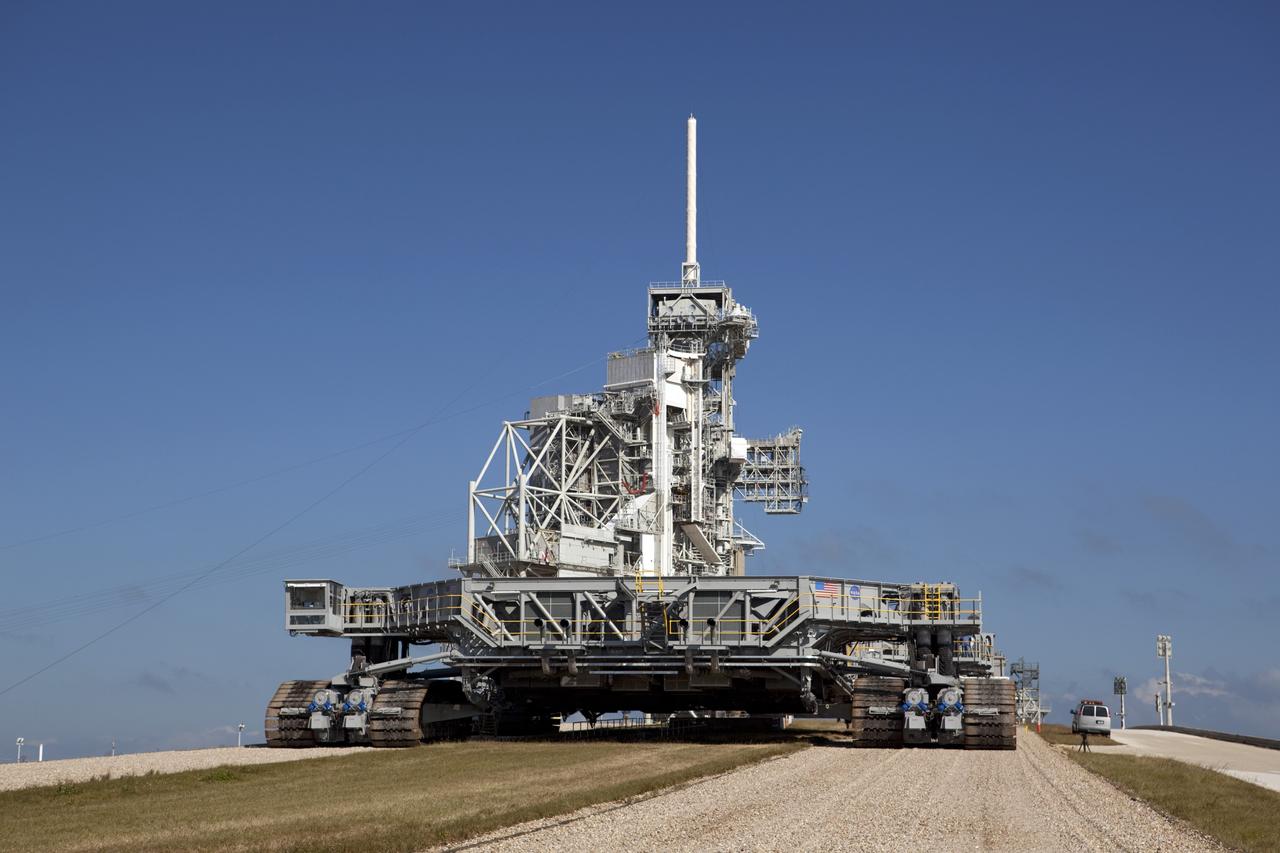 CAPE CANAVERAL, Fla. -- At NASA's Kennedy Space Center in Florida, crawler-transporter No. 2 arrives at Launch Pad 39A to check out recently completed modifications to ensure its ability to carry launch vehicles such as the space agency's Space Launch System heavy-lift rocket to the pad. NASA's Ground Systems Development and Operations Program is leading the 20-year life-extension project for the crawler. A pair of behemoth machines called crawler-transporters has carried the load of taking rockets and spacecraft to the launch pad for more than 40 years at NASA’s Kennedy Space Center in Florida. Each the size of a baseball infield and powered by locomotive and large electrical power generator engines, the crawler-transporters will stand ready to keep up the work for the next generation of launch vehicles to lift astronauts into space. For more information, visit http://www.nasa.gov/exploration/systems/ground/index.html Photo credit: NASA/ Dimitri Gerondidakis
