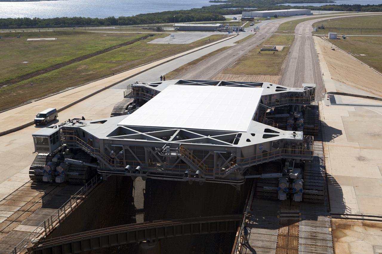 CAPE CANAVERAL, Fla. -- At NASA's Kennedy Space Center in Florida, crawler-transporter No. 2 arrives at Launch Pad 39A to check out recently completed modifications to ensure its ability to carry launch vehicles such as the space agency's Space Launch System heavy-lift rocket to the pad. NASA's Ground Systems Development and Operations Program is leading the 20-year life-extension project for the crawler. A pair of behemoth machines called crawler-transporters has carried the load of taking rockets and spacecraft to the launch pad for more than 40 years at NASA’s Kennedy Space Center in Florida. Each the size of a baseball infield and powered by locomotive and large electrical power generator engines, the crawler-transporters will stand ready to keep up the work for the next generation of launch vehicles to lift astronauts into space. For more information, visit http://www.nasa.gov/exploration/systems/ground/index.html Photo credit: NASA/ Dimitri Gerondidakis