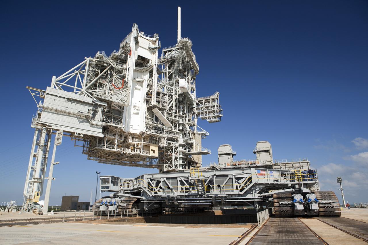 CAPE CANAVERAL, Fla. -- At NASA's Kennedy Space Center in Florida, crawler-transporter No. 2 arrives at Launch Pad 39A to check out recently completed modifications to ensure its ability to carry launch vehicles such as the space agency's Space Launch System heavy-lift rocket to the pad. NASA's Ground Systems Development and Operations Program is leading the 20-year life-extension project for the crawler. A pair of behemoth machines called crawler-transporters has carried the load of taking rockets and spacecraft to the launch pad for more than 40 years at NASA’s Kennedy Space Center in Florida. Each the size of a baseball infield and powered by locomotive and large electrical power generator engines, the crawler-transporters will stand ready to keep up the work for the next generation of launch vehicles to lift astronauts into space. For more information, visit http://www.nasa.gov/exploration/systems/ground/index.html Photo credit: NASA/ Dimitri Gerondidakis