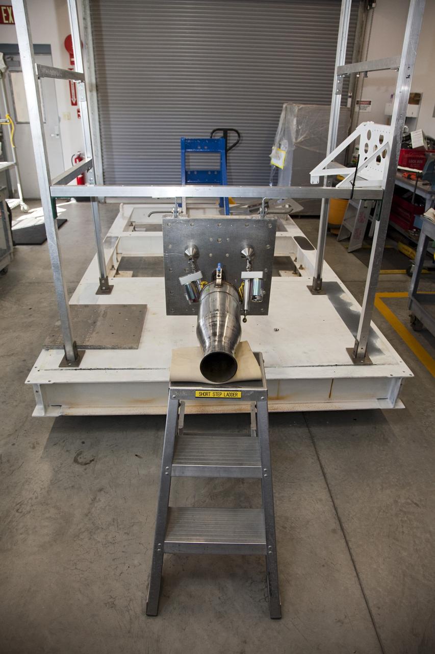 CAPE CANAVERAL, Fla. -- At the Neo Liquid Propellant Testbed inside a facility near Kennedy Space Center’s Shuttle Landing Facility in Florida, engineers are working on the buildup of the Neo test fixture and an Injector 71 engine that uses super-cooled propellants.      NASA engineers are working on the design and assembly of the Neo Liquid Propellant Testbed as part of the Engineering Directorate’s Rocket University training program. Photo credit: NASA/Frankie Martin