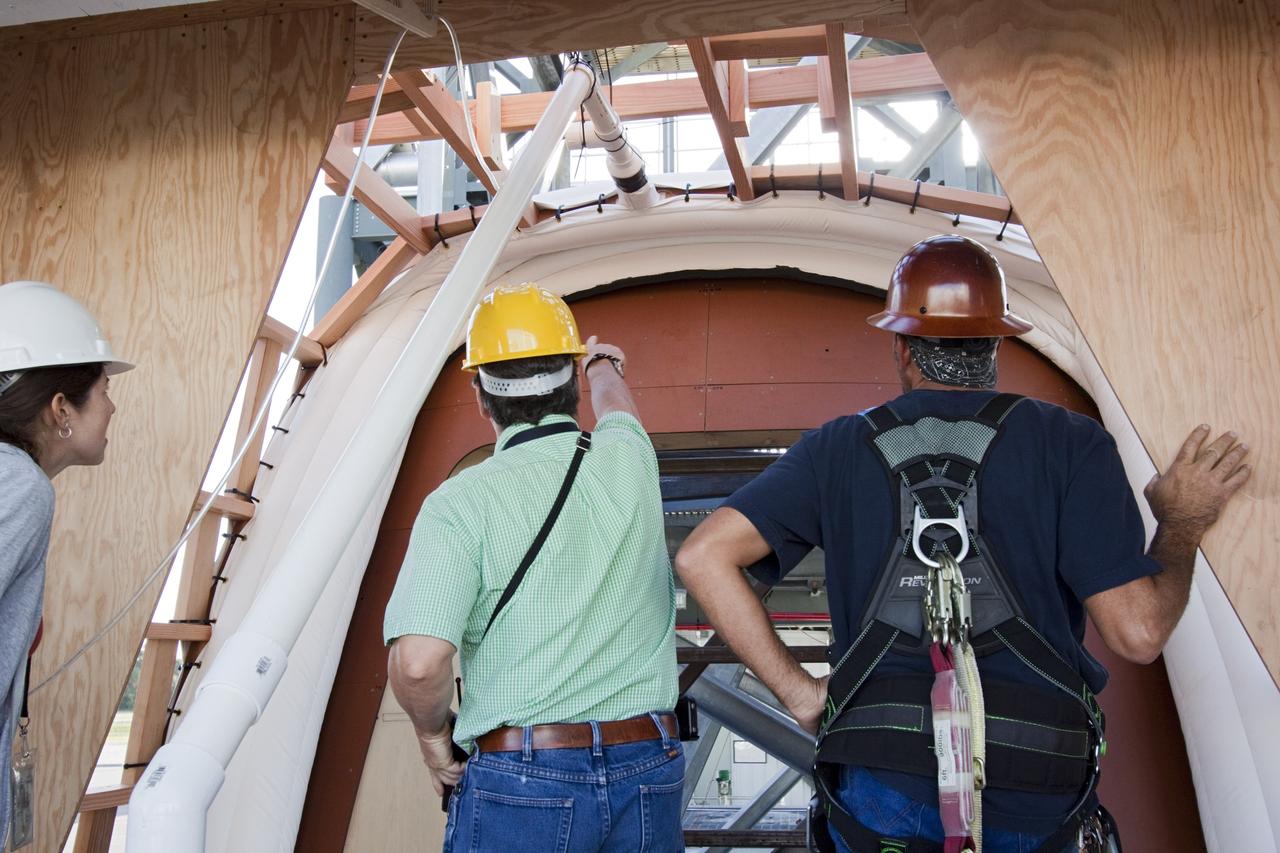 CAPE CANAVERAL, Fla. – The Orion spacecraft crew access arm, or CAA, seal prototype is being checked by technicians and engineers at the Launch Equipment Test Facility at NASAs Kennedy Space Center in Florida. The tests will use a mockup of the vehicle Outer Mold Line and CAA white room to assess the performance of the seal while simulating vehicle to CAA white room excursions. Orion is the exploration spacecraft designed to carry crews to space beyond low Earth orbit. It will provide emergency abort capability, sustain the crew during the space travel and provide safe re-entry from deep space return velocities. The first unpiloted test flight of the Orion is scheduled to launch in 2014 atop a Delta IV rocket and in 2017 on a Space Launch System rocket. For more information, visit http://www.nasa.gov/orion Photo credit: NASA/Jim Grossmann