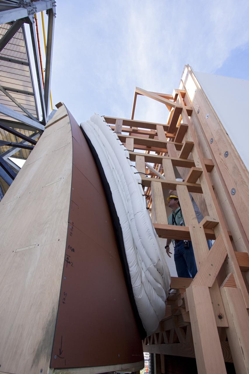 CAPE CANAVERAL, Fla. – The Orion spacecraft crew access arm, or CAA, seal prototype is being checked out at the Launch Equipment Test Facility at NASA's Kennedy Space Center in Florida. The tests will use a mockup of the vehicle Outer Mold Line and CAA white room to test the performance of the seal while simulating vehicle to CAA white room excursions. Orion is the exploration spacecraft designed to carry crews to space beyond low Earth orbit. It will provide emergency abort capability, sustain the crew during the space travel and provide safe re-entry from deep space return velocities. The first unpiloted test flight of the Orion is scheduled to launch in 2014 atop a Delta IV rocket and in 2017 on a Space Launch System rocket. For more information, visit http://www.nasa.gov/orion Photo credit: NASA/Jim Grossmann