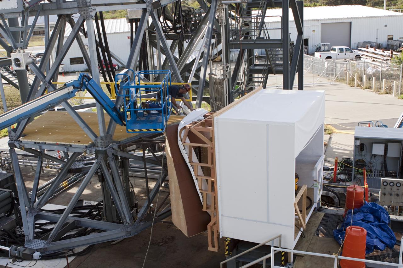 CAPE CANAVERAL, Fla. – The Orion spacecraft crew access arm, or CAA, seal prototype is being checked out at the Launch Equipment Test Facility at NASA's Kennedy Space Center in Florida. The tests will use a mockup of the vehicle Outer Mold Line and CAA white room to test the performance of the seal while simulating vehicle to CAA white room excursions. Orion is the exploration spacecraft designed to carry crews to space beyond low Earth orbit. It will provide emergency abort capability, sustain the crew during the space travel and provide safe re-entry from deep space return velocities. The first unpiloted test flight of the Orion is scheduled to launch in 2014 atop a Delta IV rocket and in 2017 on a Space Launch System rocket. For more information, visit http://www.nasa.gov/orion Photo credit: NASA/Jim Grossmann