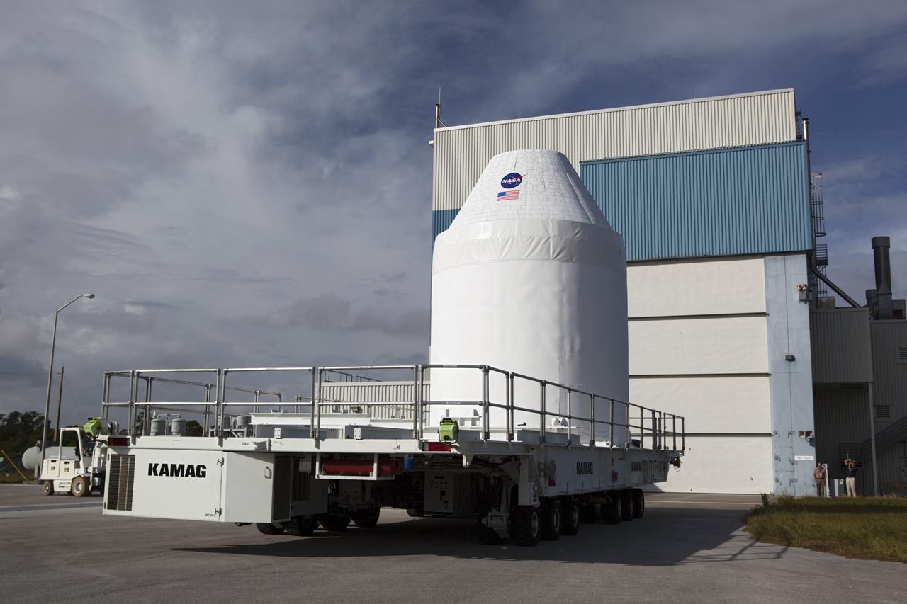 CAPE CANAVERAL, Fla. – A full-size test mock-up of the Orion spacecraft arrives at the Multi-Payload Processing Facility, or MPPF, at NASA's Kennedy Space Center in Florida to test the path flight hardware will take during future launch processing. Orion is the exploration spacecraft designed to carry crews to space beyond low Earth orbit. It will provide emergency abort capability, sustain the crew during the space travel and provide safe re-entry from deep space return velocities. The first unpiloted test flight of the Orion is scheduled to launch in 2014 atop a Delta IV rocket and in 2017 on a Space Launch System rocket. For more information, visit http://www.nasa.gov/orion Photo credit: NASA/Dimitri Gerondidakis