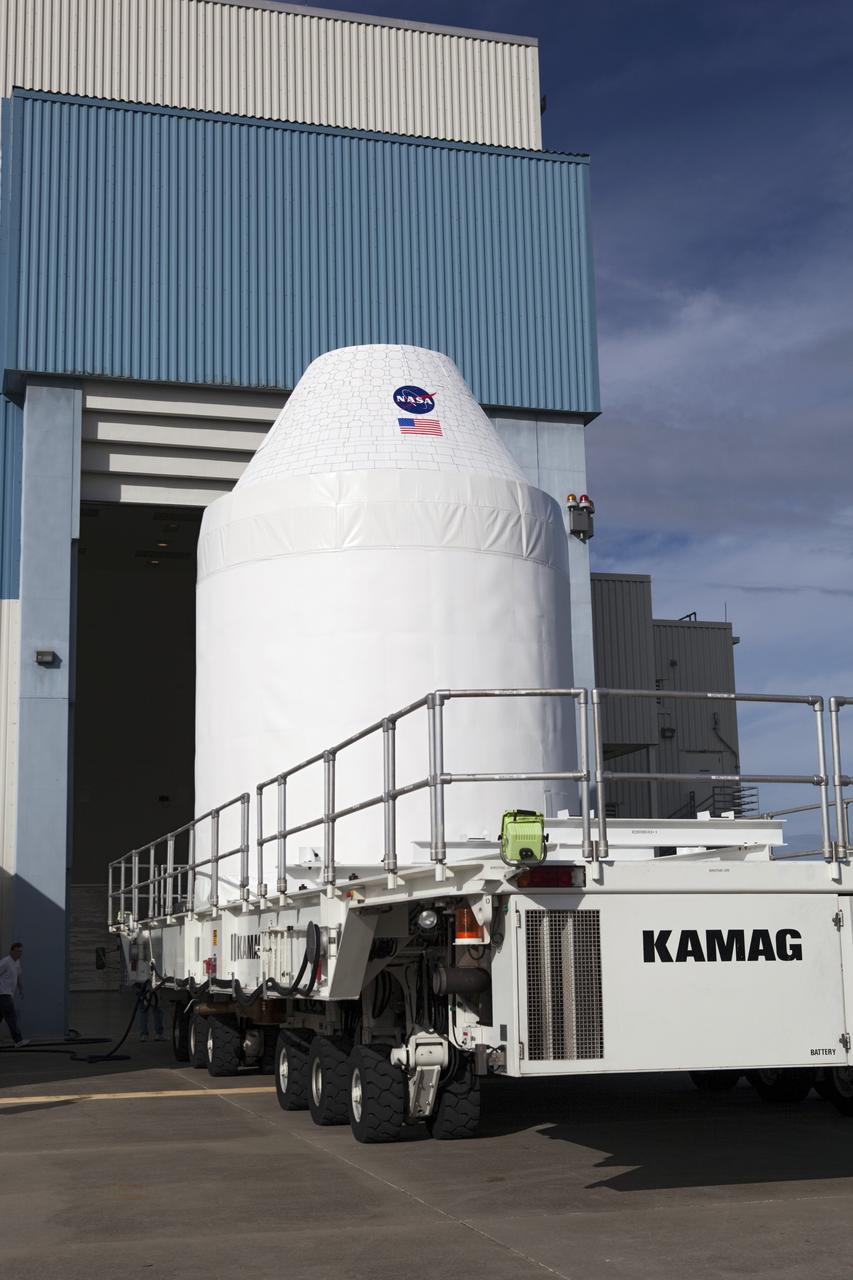 CAPE CANAVERAL, Fla. – A full-size test mock-up of the Orion crew exploration vehicle arrives at the Multi-Payload Processing Facility, or MPPF, at NASA's Kennedy Space Center in Florida to test the path flight hardware will take during future launch processing. Orion is the exploration spacecraft designed to carry crews to space beyond low Earth orbit. It will provide emergency abort capability, sustain the crew during the space travel and provide safe re-entry from deep space return velocities. The first unpiloted test flight of the Orion is scheduled to launch in 2014 atop a Delta IV rocket and in 2017 on a Space Launch System rocket. For more information, visit http://www.nasa.gov/orion Photo credit: NASA/Dimitri Gerondidakis