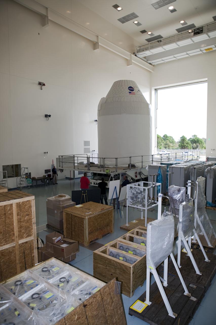 CAPE CANAVERAL, Fla. – A full-size test mock-up of the Orion spacecraft moves inside the Multi-Payload Processing Facility, or MPPF, at NASA's Kennedy Space Center in Florida to test the path flight hardware will take during future launch processing. Orion is the exploration spacecraft designed to carry crews to space beyond low Earth orbit. It will provide emergency abort capability, sustain the crew during the space travel and provide safe re-entry from deep space return velocities. The first unpiloted test flight of the Orion is scheduled to launch in 2014 atop a Delta IV rocket and in 2017 on a Space Launch System rocket. For more information, visit http://www.nasa.gov/orion Photo credit: NASA/Dimitri Gerondidakis