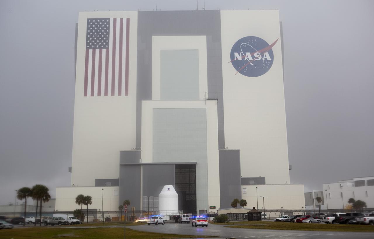CAPE CANAVERAL, Fla. – A full-size test mock-up of the Orion spacecraft arrives at the Vehicle Assembly Building at NASA's Kennedy Space Center in Florida to test the path flight hardware will take during future launch processing. Orion is the exploration spacecraft designed to carry crews to space beyond low Earth orbit. It will provide emergency abort capability, sustain the crew during the space travel and provide safe re-entry from deep space return velocities. The first unpiloted test flight of the Orion is scheduled to launch in 2014 atop a Delta IV rocket and in 2017 on a Space Launch System rocket. For more information, visit http://www.nasa.gov/orion Photo credit: NASA/Dimitri Gerondidakis