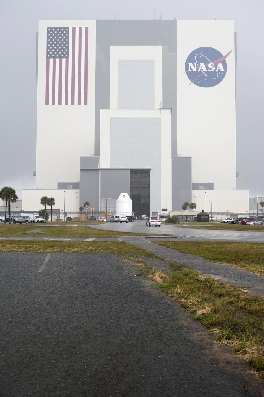CAPE CANAVERAL, Fla. – A full-size test mock-up of the Orion spacecraft arrives at the Vehicle Assembly Building at NASA's Kennedy Space Center in Florida to test the path flight hardware will take during future launch processing. Orion is the exploration spacecraft designed to carry crews to space beyond low Earth orbit. It will provide emergency abort capability, sustain the crew during the space travel and provide safe re-entry from deep space return velocities. The first unpiloted test flight of the Orion is scheduled to launch in 2014 atop a Delta IV rocket and in 2017 on a Space Launch System rocket. For more information, visit http://www.nasa.gov/orion Photo credit: NASA/Dimitri Gerondidakis