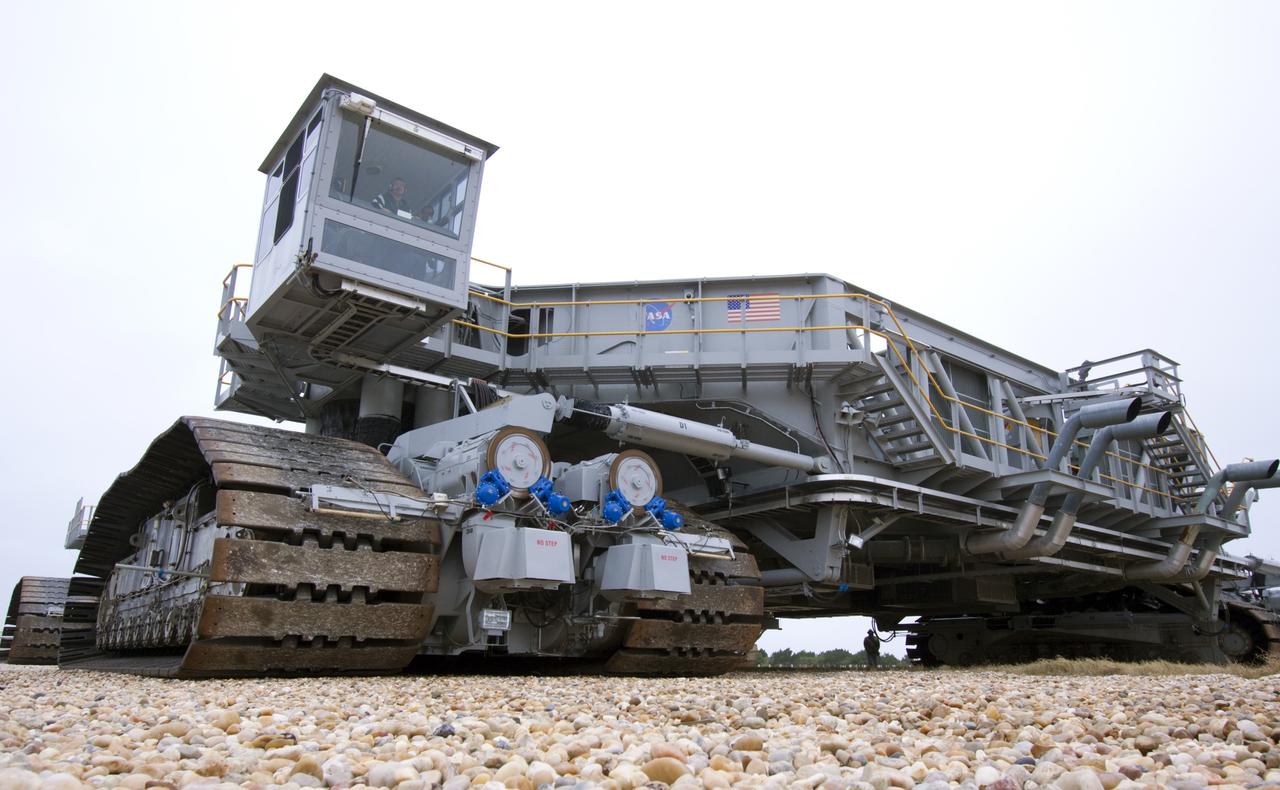 CAPE CANAVERAL, Fla. -- At NASA's Kennedy Space Center in Florida, crawler-transporter No. 2 moves along the gravel crawler way. The crawler-transporter is undergoing testing at Launch Pad 39A to check out recently completed modifications to ensure its ability to carry launch vehicles such as the space agency's Space Launch System heavy-lift rocket to the pad. NASA's Ground Systems Development and Operations Program is leading the 20-year life-extension project for the crawler. A pair of behemoth machines called crawler-transporters has carried the load of taking rockets and spacecraft to the launch pad for more than 40 years at NASA’s Kennedy Space Center in Florida. Each weighing six and a half million pounds and larger in size than a professional baseball infield, the crawler-transporters are powered by locomotive and large electrical power generator engines. The crawler-transporters will stand ready to keep up the work for the next generation of launch vehicles to lift astronauts into space. For more information, visit http://www.nasa.gov/exploration/systems/ground/index.html Photo credit: NASA/ Jim Grossmann