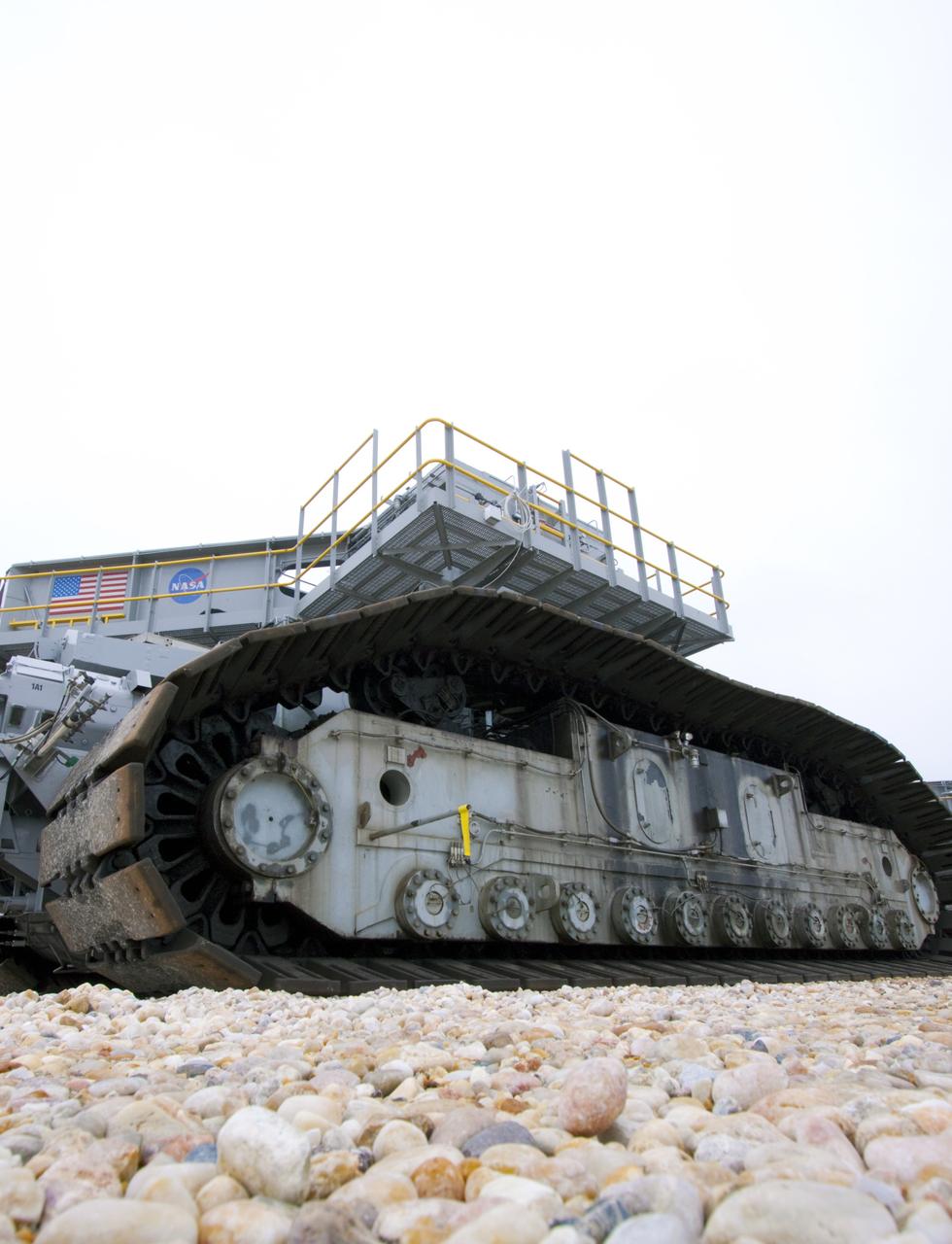 CAPE CANAVERAL, Fla. -- At NASA's Kennedy Space Center in Florida, crawler-transporter No. 2 moves along the gravel crawler way. The crawler-transporter is undergoing testing at Launch Pad 39A to check out recently completed modifications to ensure its ability to carry launch vehicles such as the space agency's Space Launch System heavy-lift rocket to the pad. NASA's Ground Systems Development and Operations Program is leading the 20-year life-extension project for the crawler. A pair of behemoth machines called crawler-transporters has carried the load of taking rockets and spacecraft to the launch pad for more than 40 years at NASA’s Kennedy Space Center in Florida. Each weighing six and a half million pounds and larger in size than a professional baseball infield, the crawler-transporters are powered by locomotive and large electrical power generator engines. The crawler-transporters will stand ready to keep up the work for the next generation of launch vehicles to lift astronauts into space. For more information, visit http://www.nasa.gov/exploration/systems/ground/index.html Photo credit: NASA/ Jim Grossmann