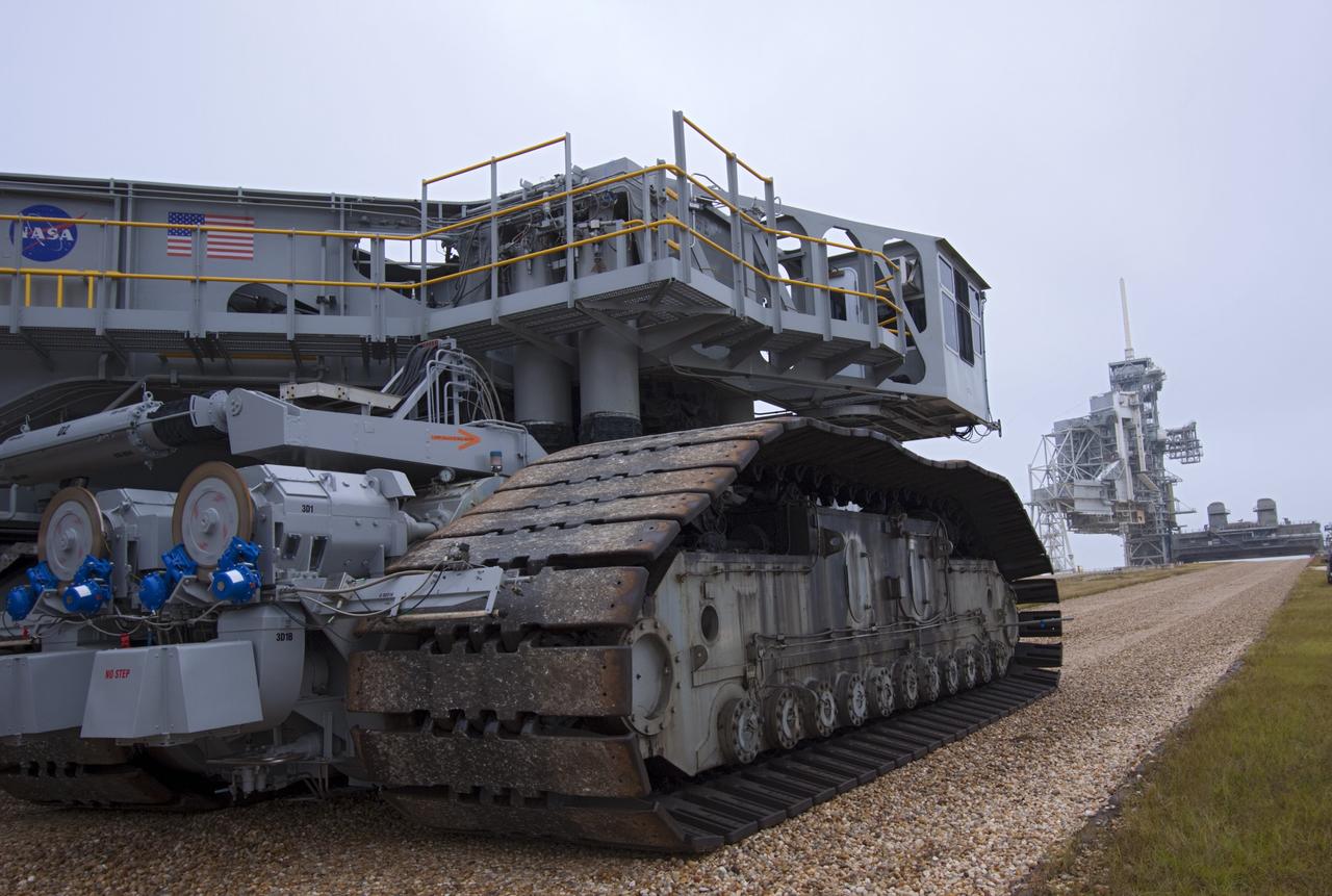 CAPE CANAVERAL, Fla. -- At NASA's Kennedy Space Center in Florida, crawler-transporter No. 2 moves along the gravel crawler way. The crawler-transporter is undergoing testing at Launch Pad 39A to check out recently completed modifications to ensure its ability to carry launch vehicles such as the space agency's Space Launch System heavy-lift rocket to the pad. NASA's Ground Systems Development and Operations Program is leading the 20-year life-extension project for the crawler. A pair of behemoth machines called crawler-transporters has carried the load of taking rockets and spacecraft to the launch pad for more than 40 years at NASA’s Kennedy Space Center in Florida. Each weighing six and a half million pounds and larger in size than a professional baseball infield, the crawler-transporters are powered by locomotive and large electrical power generator engines. The crawler-transporters will stand ready to keep up the work for the next generation of launch vehicles to lift astronauts into space. For more information, visit http://www.nasa.gov/exploration/systems/ground/index.html Photo credit: NASA/ Jim Grossmann