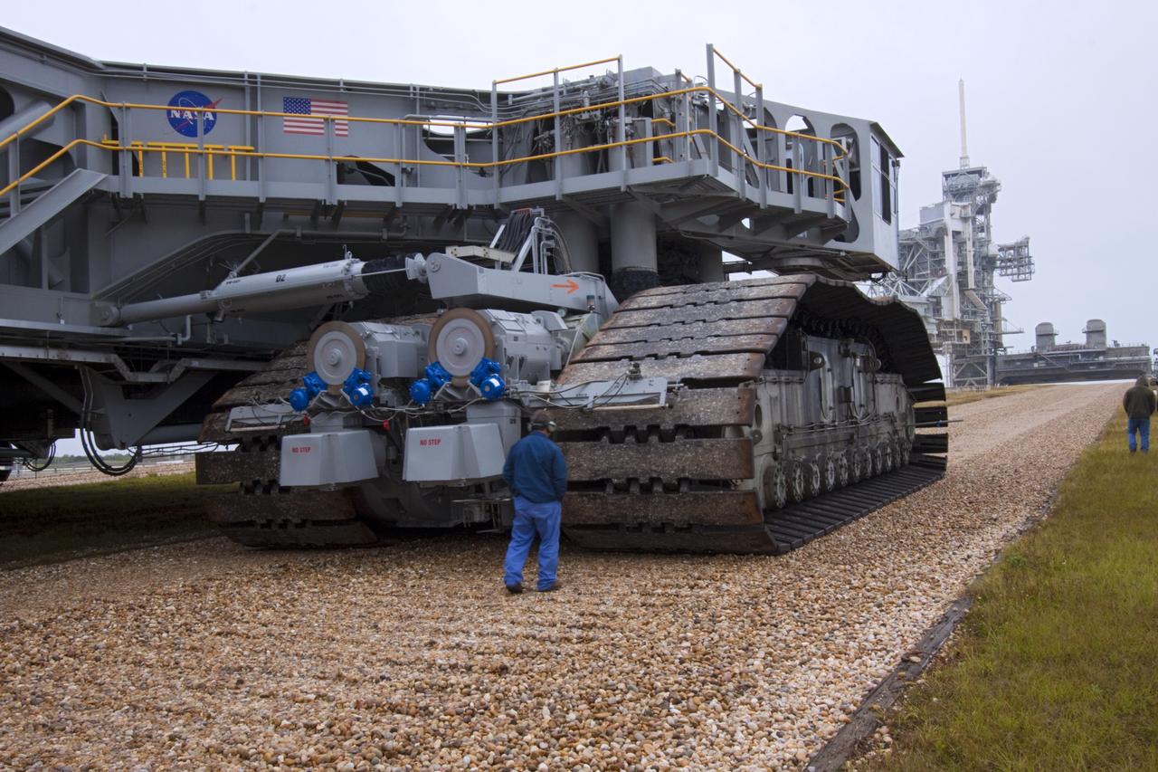 CAPE CANAVERAL, Fla. -- Technicians monitor progress as crawler-transporter No. 2 moves along the gravel crawler way at NASA's Kennedy Space Center in Florida. The crawler-transporter is undergoing testing at Launch Pad 39A to check out recently completed modifications to ensure its ability to carry launch vehicles such as the space agency's Space Launch System heavy-lift rocket to the pad. NASA's Ground Systems Development and Operations Program is leading the 20-year life-extension project for the crawler. A pair of behemoth machines called crawler-transporters has carried the load of taking rockets and spacecraft to the launch pad for more than 40 years at NASA’s Kennedy Space Center in Florida. Each weighing six and a half million pounds and larger in size than a professional baseball infield, the crawler-transporters are powered by locomotive and large electrical power generator engines. The crawler-transporters will stand ready to keep up the work for the next generation of launch vehicles to lift astronauts into space. For more information, visit http://www.nasa.gov/exploration/systems/ground/index.html Photo credit: NASA/ Jim Grossmann