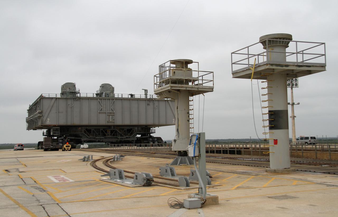 CAPE CANAVERAL, Fla. -- At NASA's Kennedy Space Center in Florida, crawler-transporter No. 2 moves a space shuttle era mobile launcher platform on Launch Pad 39A. The activity was part of testing to check out recently completed modifications to ensure its ability to carry launch vehicles such as the space agency's Space Launch System heavy-lift rocket to the pad. NASA's Ground Systems Development and Operations Program is leading the 20-year life-extension project for the crawler. A pair of behemoth machines called crawler-transporters has carried the load of taking rockets and spacecraft to the launch pad for more than 40 years at NASA’s Kennedy Space Center in Florida. Each weighing six and a half million pounds and larger in size than a professional baseball infield, the crawler-transporters are powered by locomotive and large electrical power generator engines. The crawler-transporters will stand ready to keep up the work for the next generation of launch vehicles to lift astronauts into space. For more information, visit http://www.nasa.gov/exploration/systems/ground/index.html Photo credit: NASA/Cory Huston