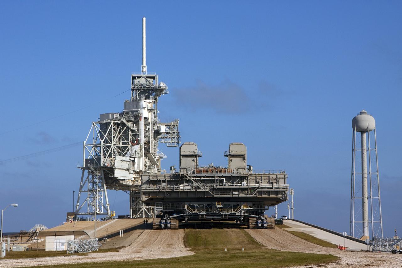 CAPE CANAVERAL, Fla. -- At NASA's Kennedy Space Center in Florida, crawler-transporter No. 2 moves a space shuttle era mobile launcher platform at Launch Pad 39A. The activity was part of testing to check out recently completed modifications to ensure its ability to carry launch vehicles such as the space agency's Space Launch System heavy-lift rocket to the pad. NASA's Ground Systems Development and Operations Program is leading the 20-year life-extension project for the crawler. A pair of behemoth machines called crawler-transporters has carried the load of taking rockets and spacecraft to the launch pad for more than 40 years at NASA’s Kennedy Space Center in Florida. Each weighing six and a half million pounds and larger in size than a professional baseball infield, the crawler-transporters are powered by locomotive and large electrical power generator engines. The crawler-transporters will stand ready to keep up the work for the next generation of launch vehicles to lift astronauts into space. For more information, visit http://www.nasa.gov/exploration/systems/ground/index.html Photo credit: NASA/Jim Grossmann