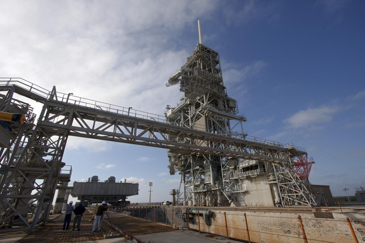 CAPE CANAVERAL, Fla. -- At NASA's Kennedy Space Center in Florida, technicians use instrumentation to ensure accuracy as crawler-transporter No. 2 moves a space shuttle era mobile launcher platform into position for placement at Launch Pad 39A. The activity was part of testing to check out recently completed modifications to ensure its ability to carry launch vehicles such as the space agency's Space Launch System heavy-lift rocket to the pad. NASA's Ground Systems Development and Operations Program is leading the 20-year life-extension project for the crawler. A pair of behemoth machines called crawler-transporters has carried the load of taking rockets and spacecraft to the launch pad for more than 40 years at NASA’s Kennedy Space Center in Florida. Each weighing six and a half million pounds and larger in size than a professional baseball infield, the crawler-transporters are powered by locomotive and large electrical power generator engines. The crawler-transporters will stand ready to keep up the work for the next generation of launch vehicles to lift astronauts into space. For more information, visit http://www.nasa.gov/exploration/systems/ground/index.html Photo credit: NASA/Jim Grossmann