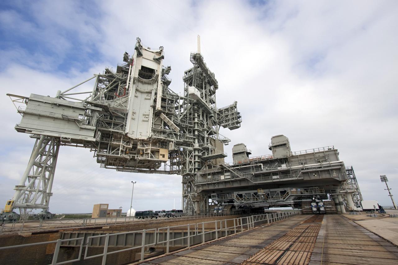 CAPE CANAVERAL, Fla. -- At NASA's Kennedy Space Center in Florida, crawler-transporter No. 2 moves a space shuttle era mobile launcher platform at Launch Pad 39A. The activity was part of testing to check out recently completed modifications to ensure its ability to carry launch vehicles such as the space agency's Space Launch System heavy-lift rocket to the pad. NASA's Ground Systems Development and Operations Program is leading the 20-year life-extension project for the crawler. A pair of behemoth machines called crawler-transporters has carried the load of taking rockets and spacecraft to the launch pad for more than 40 years at NASA’s Kennedy Space Center in Florida. Each weighing six and a half million pounds and larger in size than a professional baseball infield, the crawler-transporters are powered by locomotive and large electrical power generator engines. The crawler-transporters will stand ready to keep up the work for the next generation of launch vehicles to lift astronauts into space. For more information, visit http://www.nasa.gov/exploration/systems/ground/index.html Photo credit: NASA/Jim Grossmann