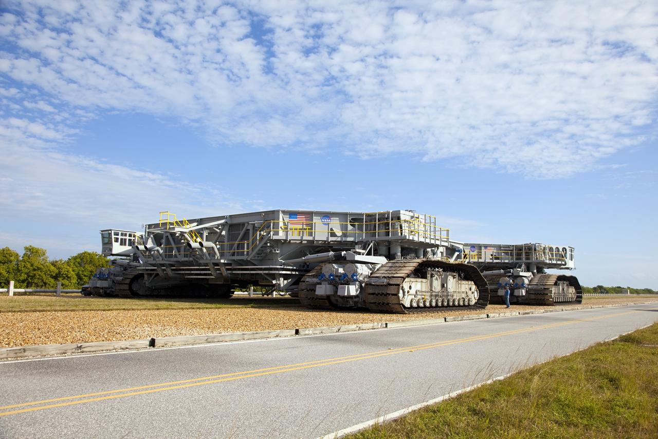 CAPE CANAVERAL, Fla. -- At NASA's Kennedy Space Center in Florida, crawler-transporter No. 2 returns to the Vehicle Assembly Building after completion of testing at Launch Pad 39A. The activity is designed to check out recently completed modifications to ensure the crawler-transporter's ability to carry launch vehicles such as the space agency's Space Launch System heavy-lift rocket to the pad. NASA's Ground Systems Development and Operations Program is leading the 20-year life-extension project for the crawler. A pair of behemoth machines called crawler-transporters has carried the load of taking rockets and spacecraft to the launch pad for more than 40 years at NASA’s Kennedy Space Center in Florida. Each weighing six and a half million pounds and larger in size than a professional baseball infield, the crawler-transporters are powered by locomotive and large electrical power generator engines. The crawler-transporters will stand ready to keep up the work for the next generation of launch vehicles to lift astronauts into space. For more information, visit http://www.nasa.gov/exploration/systems/ground/index.html Photo credit: NASA/Frankie Martin