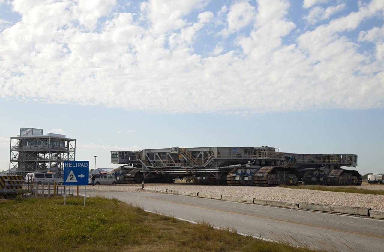 CAPE CANAVERAL, Fla. -- At NASA's Kennedy Space Center in Florida, crawler-transporter No. 2 returns to the Vehicle Assembly Building after completion of testing at Launch Pad 39A. The activity is designed to check out recently completed modifications to ensure the crawler-transporter's ability to carry launch vehicles such as the space agency's Space Launch System heavy-lift rocket to the pad. NASA's Ground Systems Development and Operations Program is leading the 20-year life-extension project for the crawler. A pair of behemoth machines called crawler-transporters has carried the load of taking rockets and spacecraft to the launch pad for more than 40 years at NASA’s Kennedy Space Center in Florida. Each weighing six and a half million pounds and larger in size than a professional baseball infield, the crawler-transporters are powered by locomotive and large electrical power generator engines. The crawler-transporters will stand ready to keep up the work for the next generation of launch vehicles to lift astronauts into space. For more information, visit http://www.nasa.gov/exploration/systems/ground/index.html Photo credit: NASA/Frankie Martin