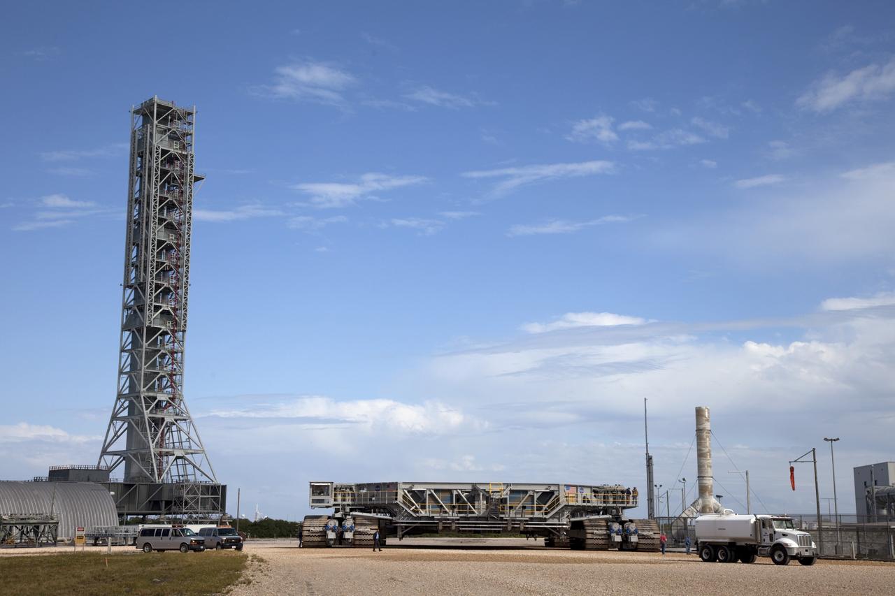 CAPE CANAVERAL, Fla. -- At NASA's Kennedy Space Center in Florida, crawler-transporter No. 2 returns toits park site after completion of testing at Launch Pad 39A. The activity is designed to check out recently completed modifications to ensure the crawler-transporter's ability to carry launch vehicles such as the space agency's Space Launch System heavy-lift rocket to the pad. NASA's Ground Systems Development and Operations Program is leading the 20-year life-extension project for the crawler. A pair of behemoth machines called crawler-transporters has carried the load of taking rockets and spacecraft to the launch pad for more than 40 years at NASA’s Kennedy Space Center in Florida. Each weighing six and a half million pounds and larger in size than a professional baseball infield, the crawler-transporters are powered by locomotive and large electrical power generator engines. The crawler-transporters will stand ready to keep up the work for the next generation of launch vehicles to lift astronauts into space. For more information, visit http://www.nasa.gov/exploration/systems/ground/index.html Photo credit: NASA/Frankie Martin