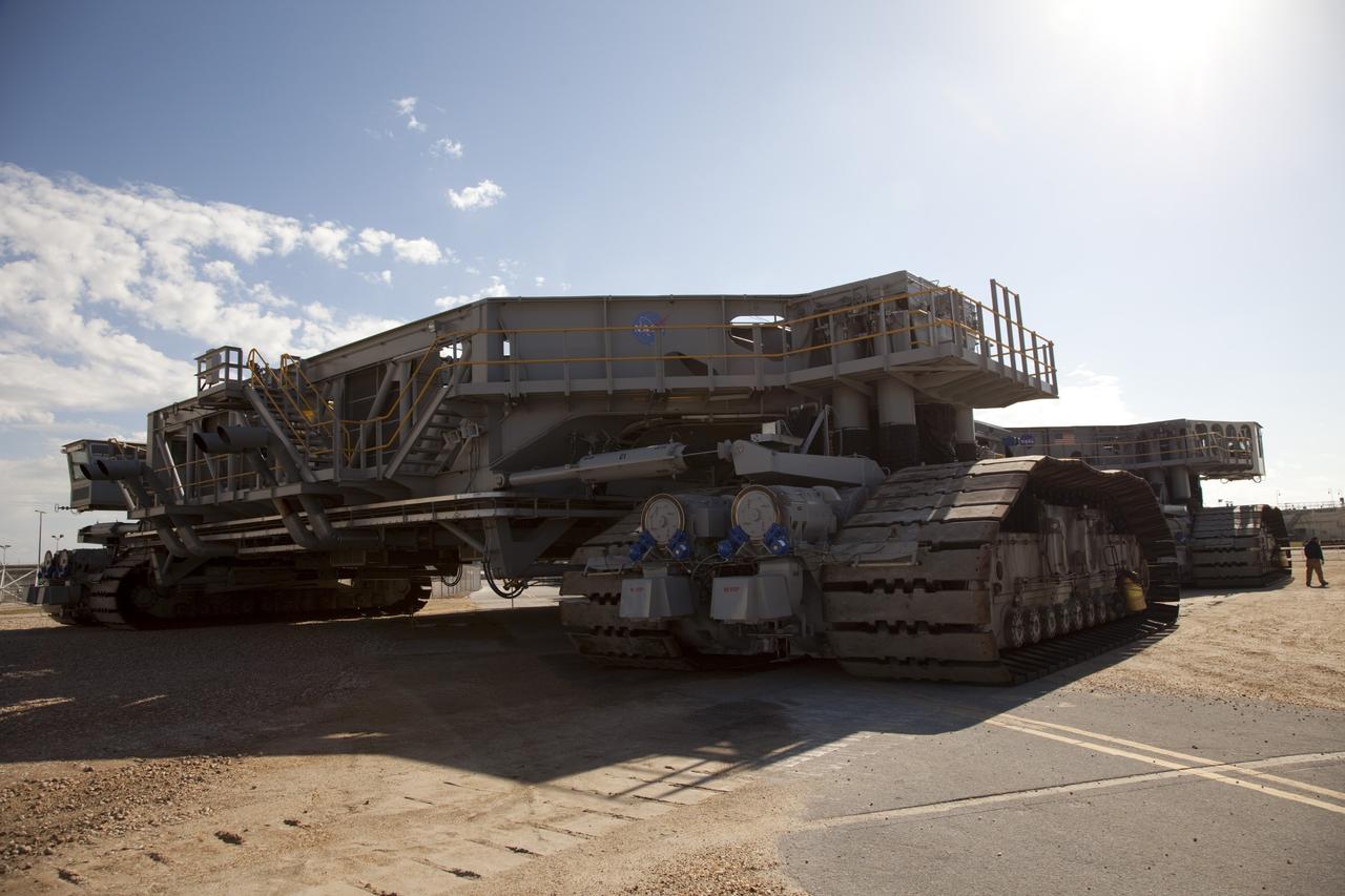 CAPE CANAVERAL, Fla. -- At NASA's Kennedy Space Center in Florida, crawler-transporter No. 2 returns to its park site after completion of testing at Launch Pad 39A. The activity is designed to check out recently completed modifications to ensure the crawler-transporter's ability to carry launch vehicles such as the space agency's Space Launch System heavy-lift rocket to the pad. NASA's Ground Systems Development and Operations Program is leading the 20-year life-extension project for the crawler. A pair of behemoth machines called crawler-transporters has carried the load of taking rockets and spacecraft to the launch pad for more than 40 years at NASA’s Kennedy Space Center in Florida. Each weighing six and a half million pounds and larger in size than a professional baseball infield, the crawler-transporters are powered by locomotive and large electrical power generator engines. The crawler-transporters will stand ready to keep up the work for the next generation of launch vehicles to lift astronauts into space. For more information, visit http://www.nasa.gov/exploration/systems/ground/index.html Photo credit: NASA/Frankie Martin