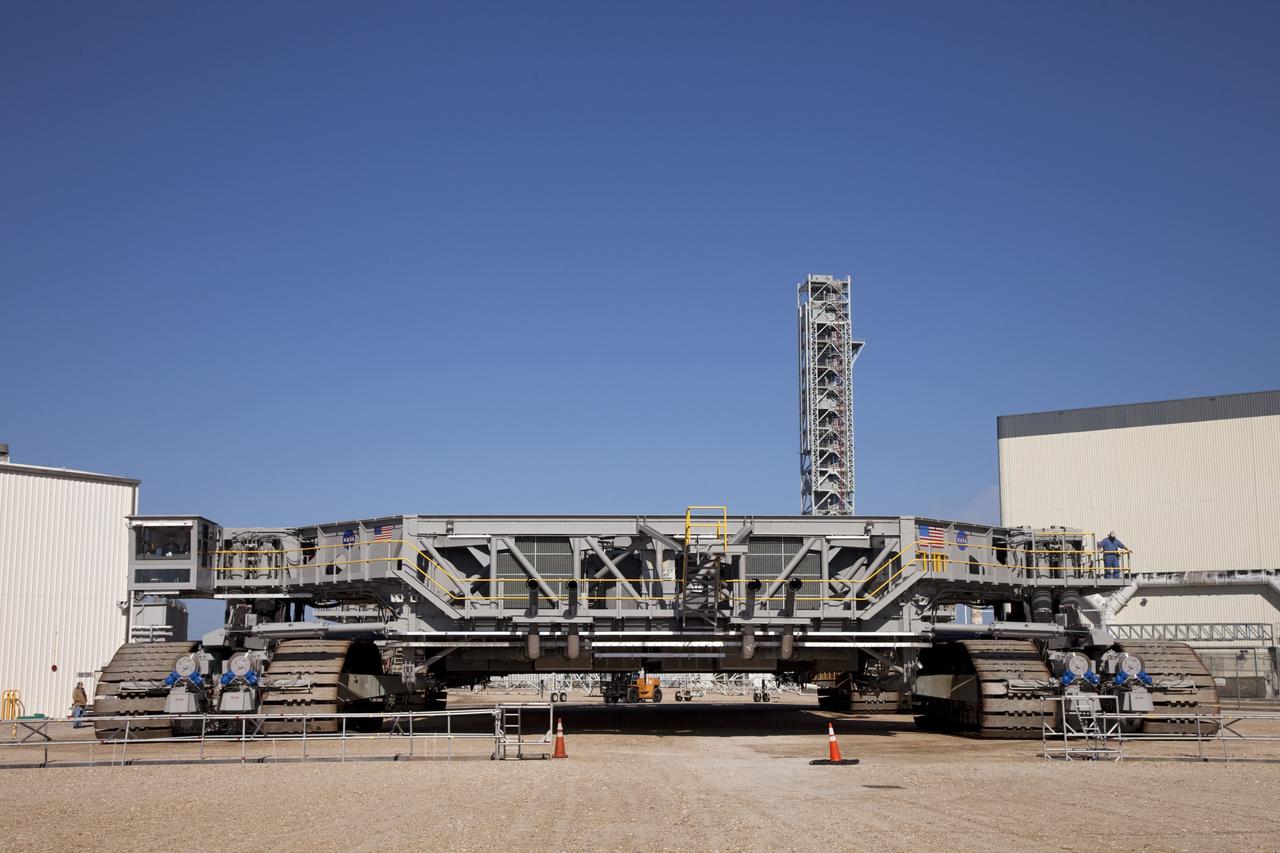 CAPE CANAVERAL, Fla. -- At NASA's Kennedy Space Center in Florida, crawler-transporter No. 2 returns to its park site after completion of testing at Launch Pad 39A. The activity is designed to check out recently completed modifications to ensure the crawler-transporter's ability to carry launch vehicles such as the space agency's Space Launch System heavy-lift rocket to the pad. NASA's Ground Systems Development and Operations Program is leading the 20-year life-extension project for the crawler. A pair of behemoth machines called crawler-transporters has carried the load of taking rockets and spacecraft to the launch pad for more than 40 years at NASA’s Kennedy Space Center in Florida. Each weighing six and a half million pounds and larger in size than a professional baseball infield, the crawler-transporters are powered by locomotive and large electrical power generator engines. The crawler-transporters will stand ready to keep up the work for the next generation of launch vehicles to lift astronauts into space. For more information, visit http://www.nasa.gov/exploration/systems/ground/index.html Photo credit: NASA/Frankie Martin