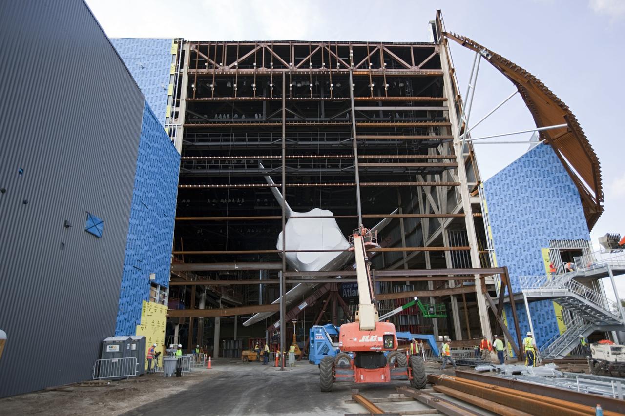 CAPE CANAVERAL, Fla. – The space shuttle Atlantis is lifted and tilted for display at the Kennedy Space Center Visitor Complex in Florida. Atlantis will be exhibited at 43.21 degrees with its payload bay doors open so the shuttle will look as it did in space. Atlantis was wrapped in a protective plastic to protect it from dust and debris while being prepared for display. The new home of Atlantis is scheduled to open in July 2013. The exhibits in the new, 90,000-square-foot interactive facility will tell the story of the 30-year Space Shuttle Program and what lies ahead in space exploration. More than 60 exhibits will be set up around Atlantis, including a full-scale mockup of the Hubble Space Telescope and a full-scale model of a portion of the International Space Station. Over the course of its 26-year career, Atlantis traveled 125,935,769 miles during 307 days in space over 33 missions. For more information, visit http://www.nasa.gov/transition Photo credit: NASA/ Dimitri Gerondidakis