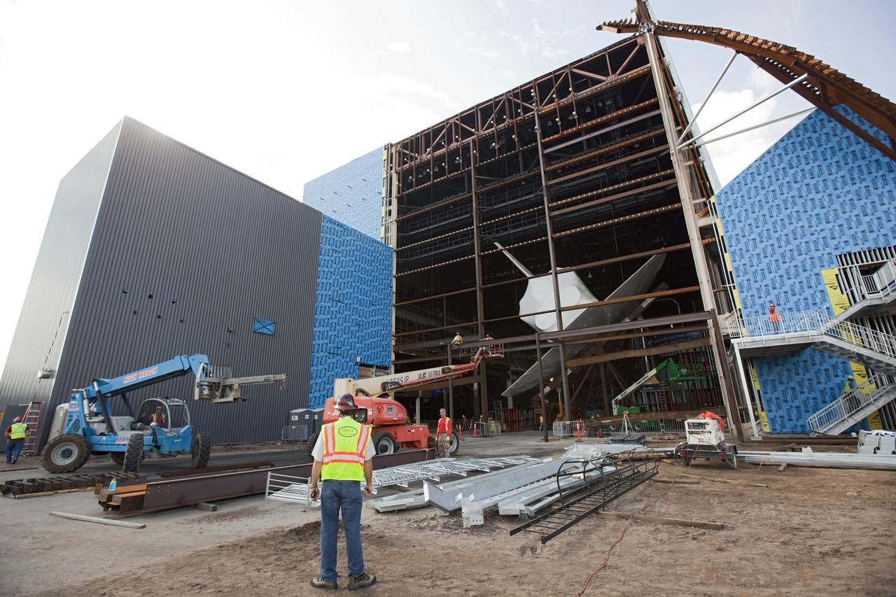 CAPE CANAVERAL, Fla. – The space shuttle Atlantis is lifted and tilted for display at the Kennedy Space Center Visitor Complex in Florida. Atlantis will be exhibited at 43.21 degrees with its payload bay doors open so the shuttle will look as it did in space. Atlantis was wrapped in a protective plastic to protect it from dust and debris while being prepared for display. The new home of Atlantis is scheduled to open in July 2013. The exhibits in the new, 90,000-square-foot interactive facility will tell the story of the 30-year Space Shuttle Program and what lies ahead in space exploration. More than 60 exhibits will be set up around Atlantis, including a full-scale mockup of the Hubble Space Telescope and a full-scale model of a portion of the International Space Station. Over the course of its 26-year career, Atlantis traveled 125,935,769 miles during 307 days in space over 33 missions. For more information, visit http://www.nasa.gov/transition Photo credit: NASA/ Dimitri Gerondidakis