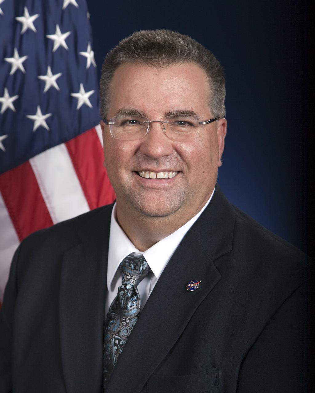 CAPE CANAVERAL, Fla. -- Official portrait of Ed Mango, manager of NASA's Commercial Crew Program at the agency's Kennedy Space Center in Florida. To learn more about Mango, go to http://www.nasa.gov/centers/kennedy/about/biographies/mango.html. Photo credit: NASA