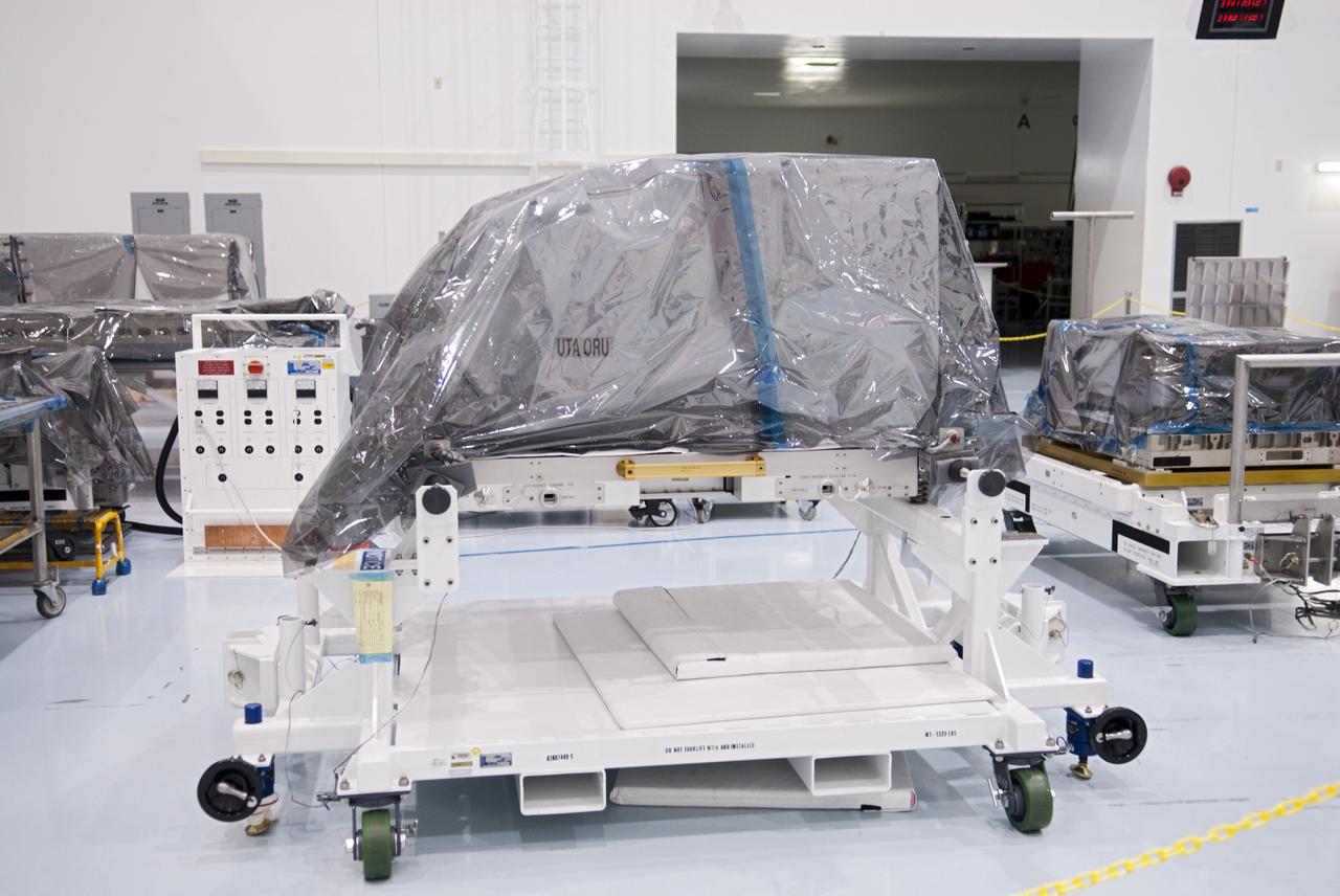 CAPE CANAVERAL, Fla. -- Inside the high bay of the Space Station Processing Facility at NASA's Kennedy Space Center in Florida, the orbital replacement unit for the space station's utility transfer assembly is prepared for placement in a shipping container. The assembly, which was processed at Kennedy, will be shipped to Japan at the beginning of the year for the HTV-4 launch, which is currently scheduled for 2013. Photo credit: NASA/Charisse Nahser